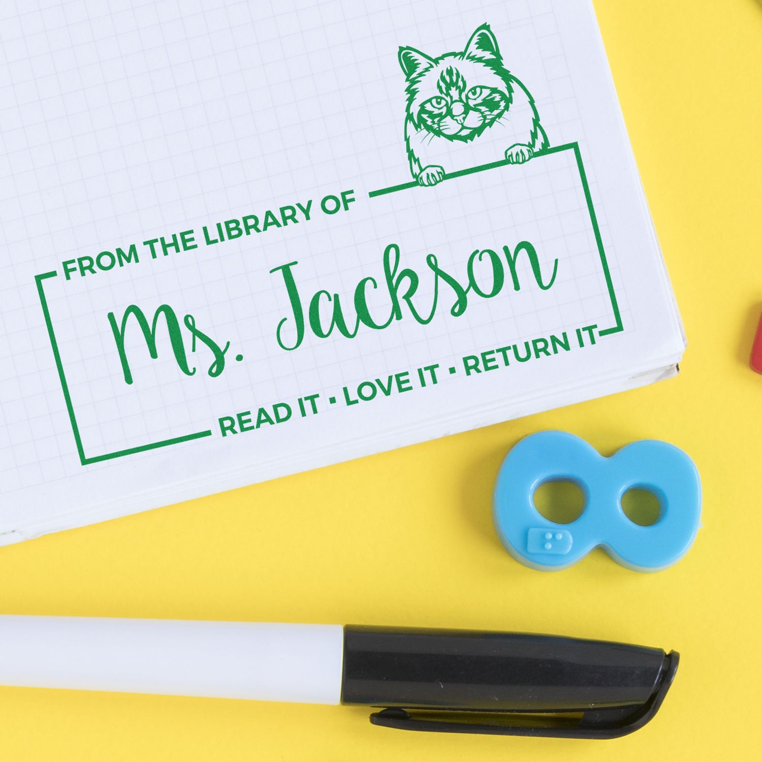 Personalized rubber library stamp for Ms. Jackson with cat icon and Read it, love it, return it book label.