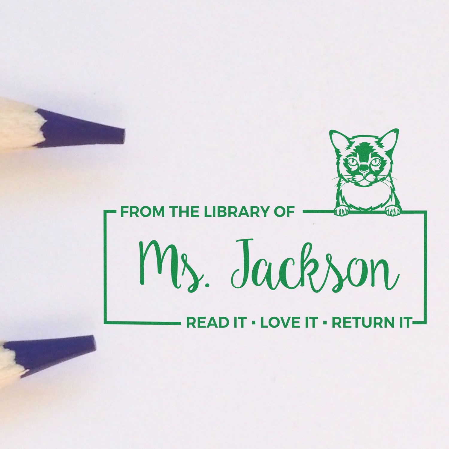 Custom teacher library rubber stamp for Ms. Jackson with cat design and Read it, Love it, Return it book label.