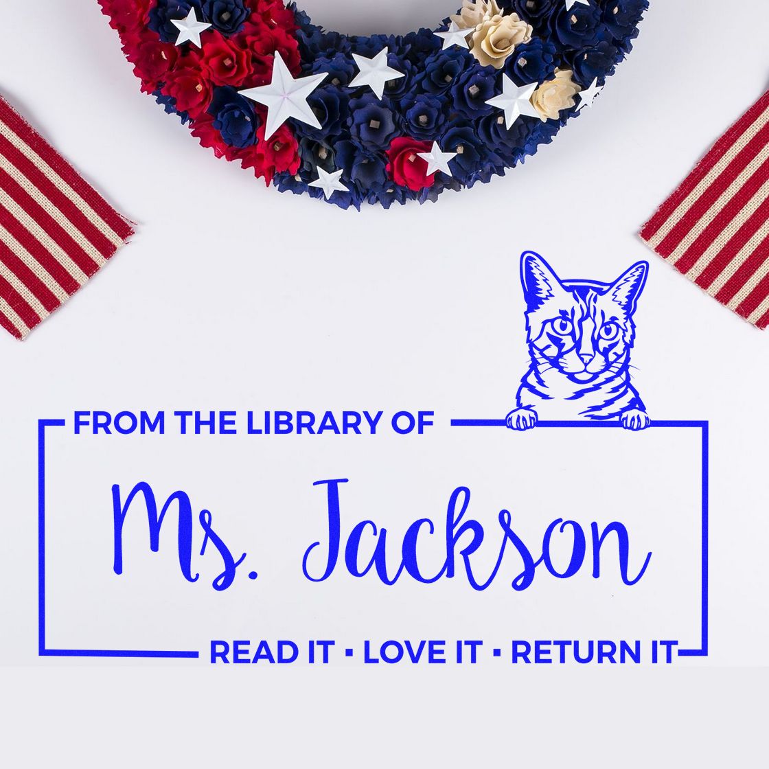 Personalized library rubber stamp for Ms. Jackson with cat design and Read it, love it, return it book label.