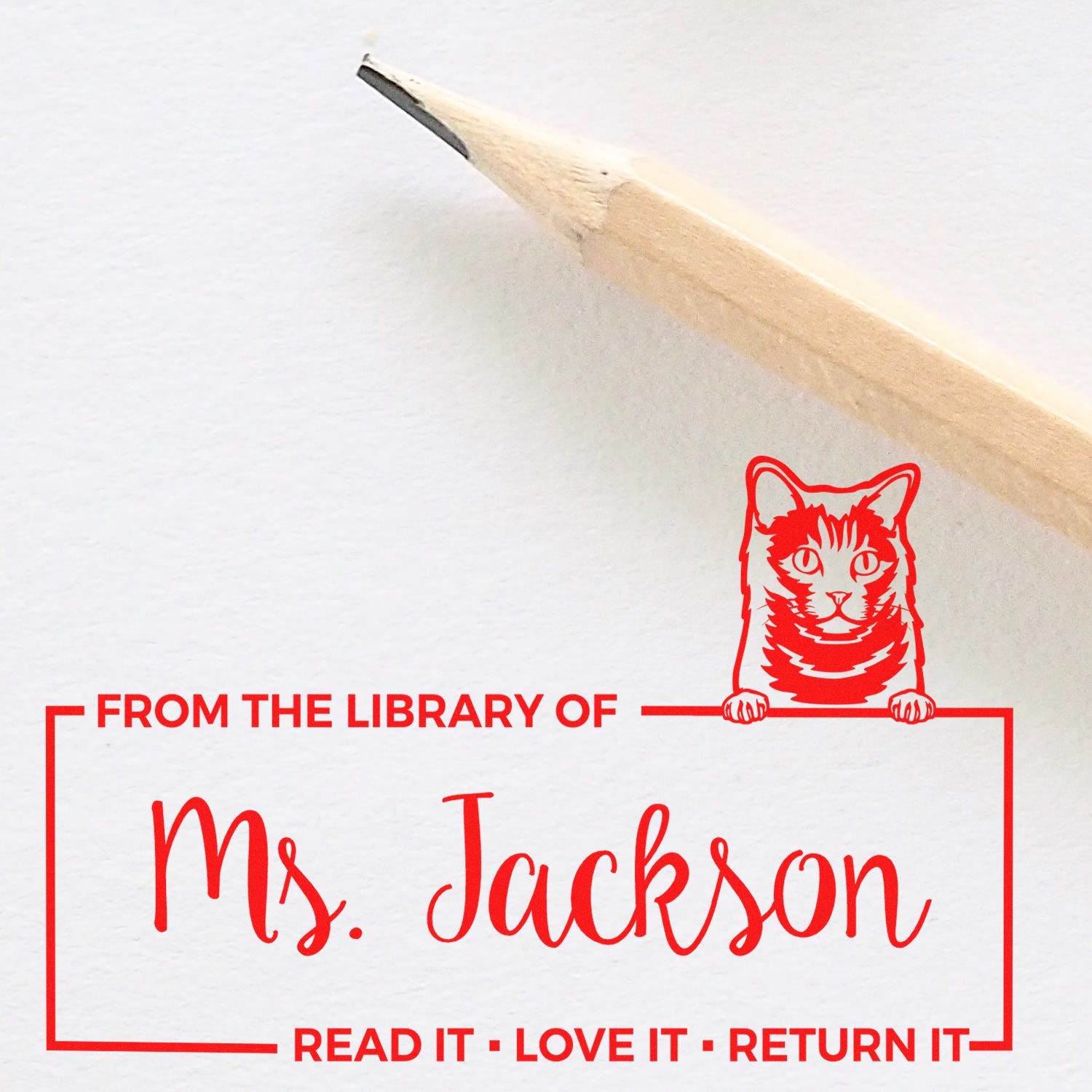 Custom personalized library rubber stamp for Ms. Jackson with cat design and Read It Love It Return It message.