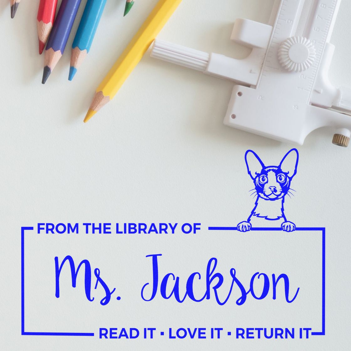 Custom rubber library stamp for Ms. Jackson with cat design and Read It, Love It, Return It book return message.