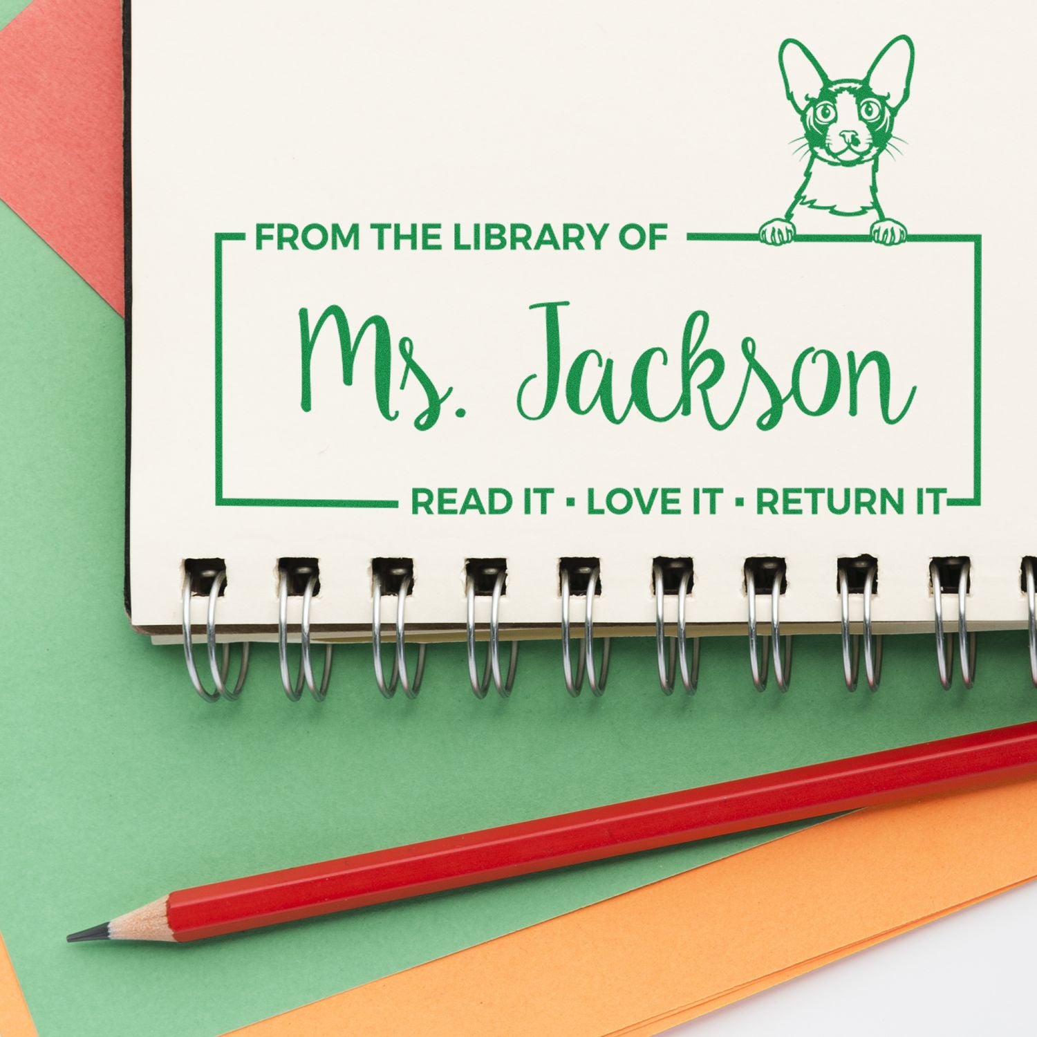 Personalized library rubber stamp for Mrs. Jackson with cat design and Read It  Love It  Return It message.