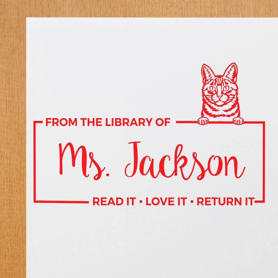 Personalized cat library rubber stamp for Ms. Jackson with From the Library Of and Read it, Love it, Return it text.