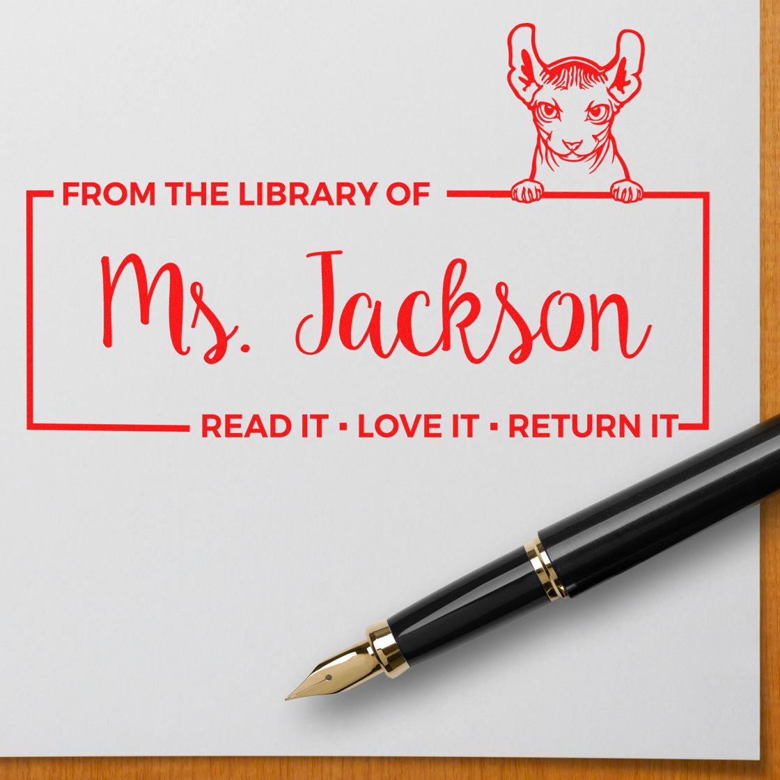 Custom library rubber stamp for Ms. Jackson with cat design and Read it, love it, return it bookplate message.