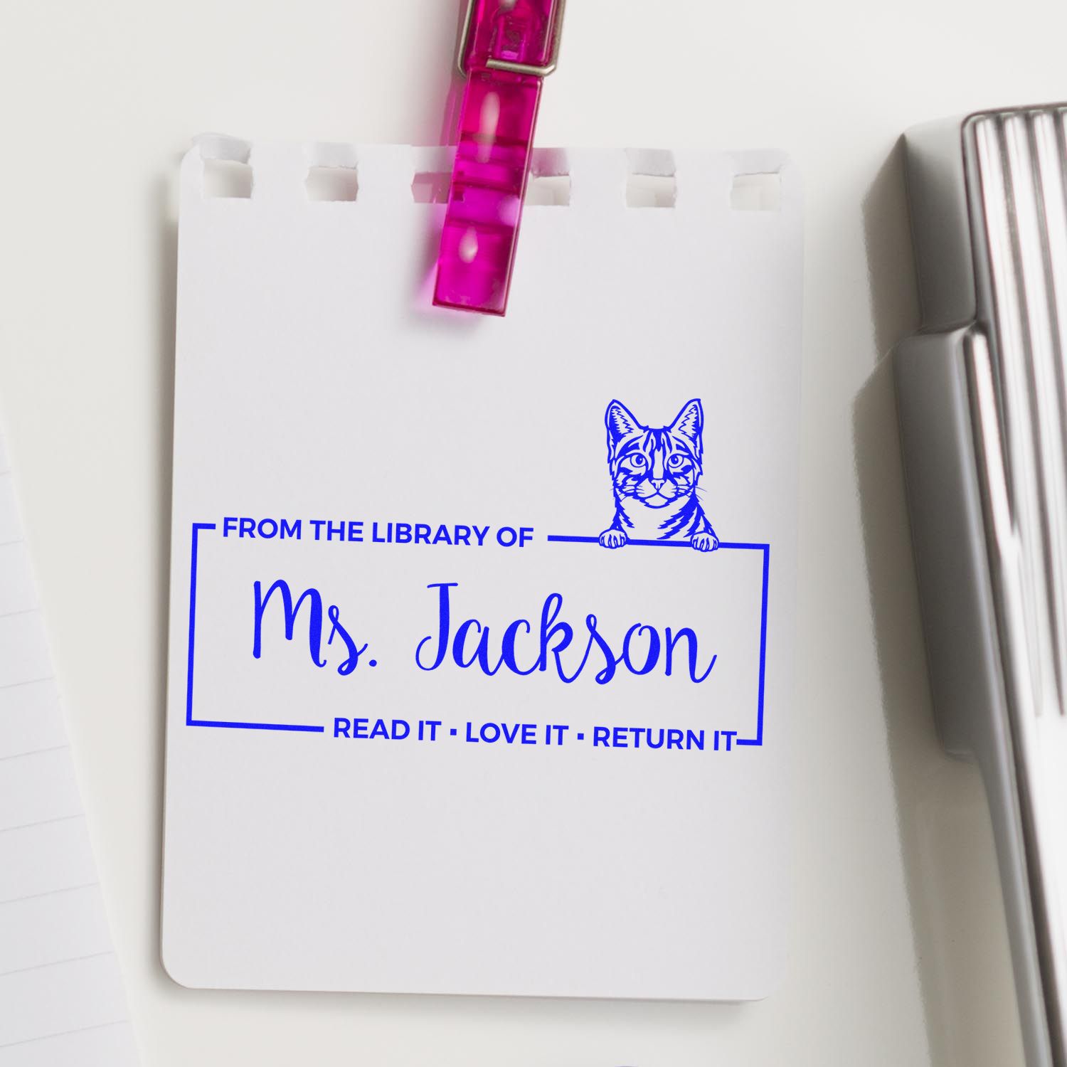 Custom library rubber stamp reading From the Library of Ms. Jackson with cat design for personal book collections.