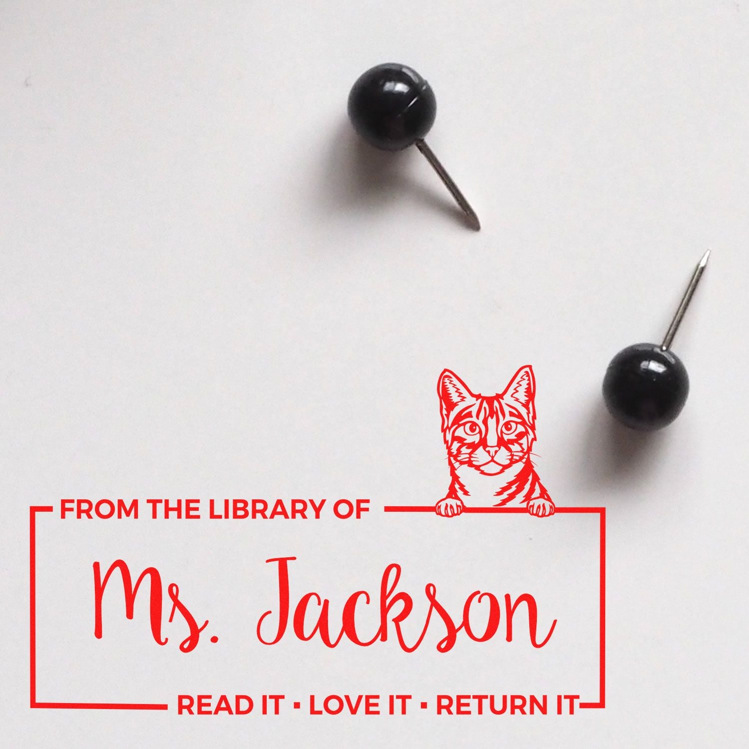 Custom From the Library of Ms. Jackson rubber stamp with cat design for personalizing books and library items.