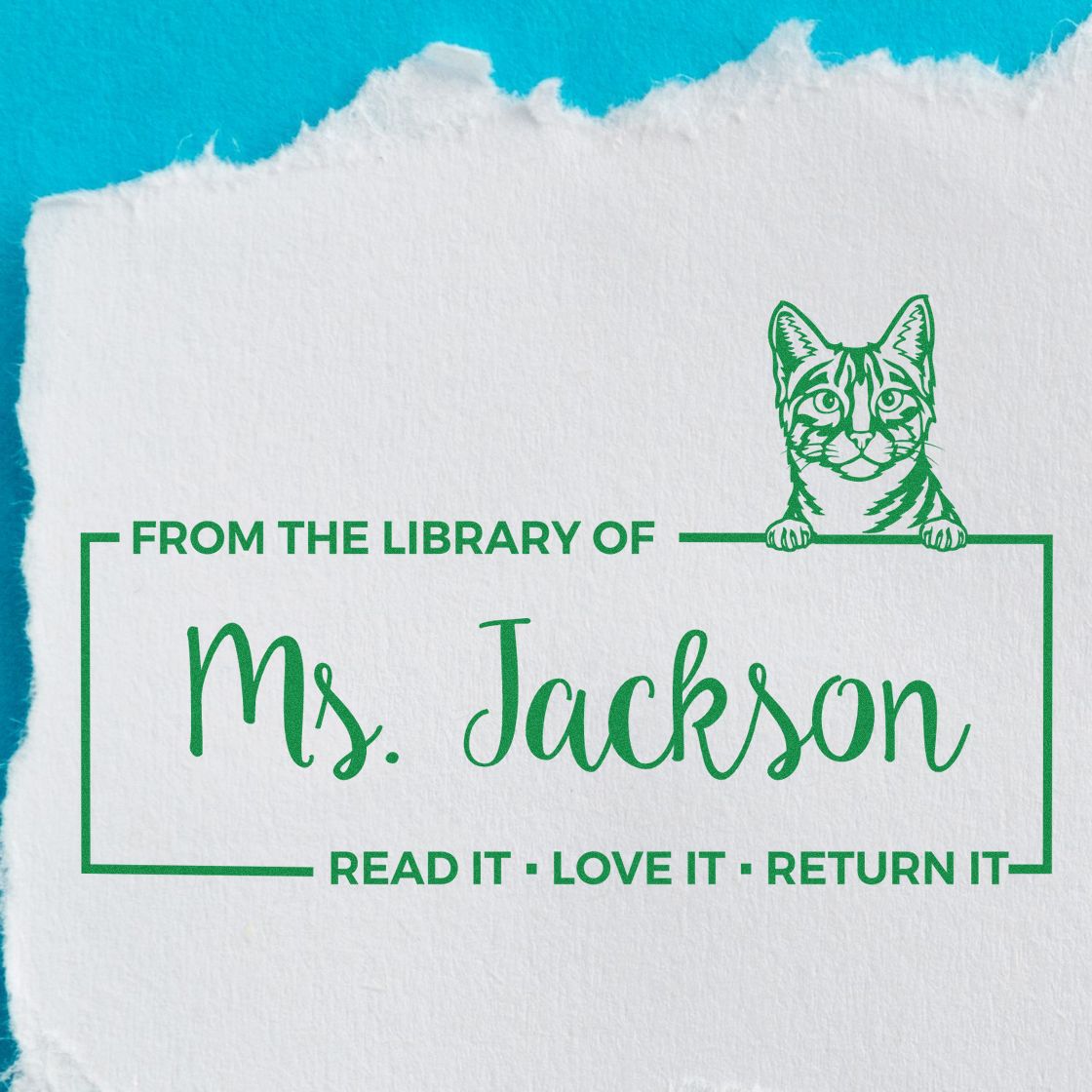 Personalized cat library rubber stamp for Ms. Jackson with Read It  Love It  Return It book return message.