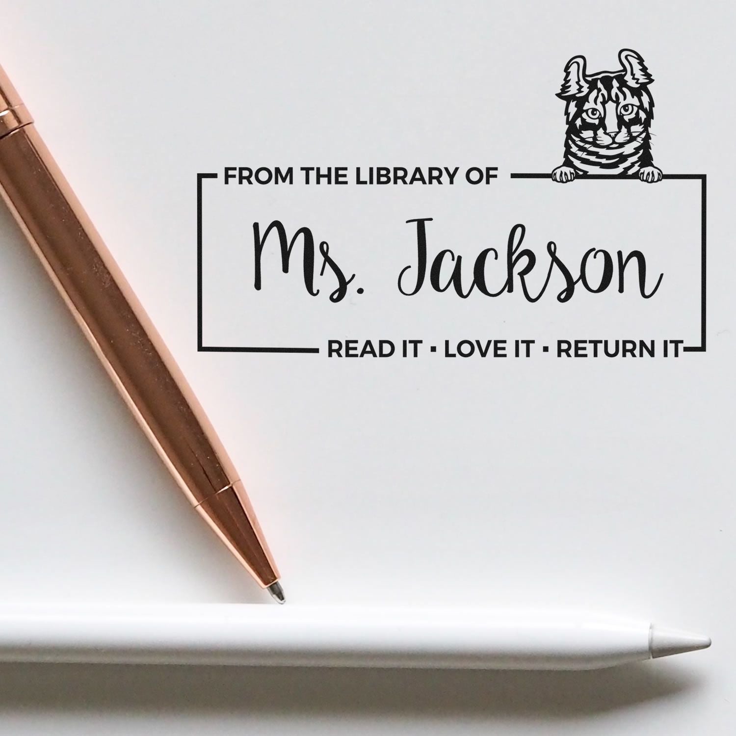 Custom library rubber stamp for Ms. Jackson, with cat design and Read it, Love it, Return it bookplate text.