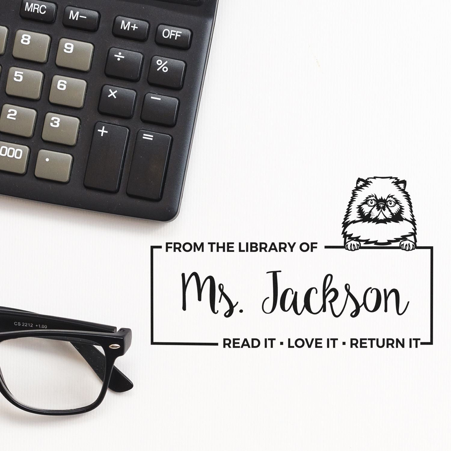 Custom library rubber stamp reading From the Library of Ms. Jackson  Read It, Love It, Return It for book lending.
