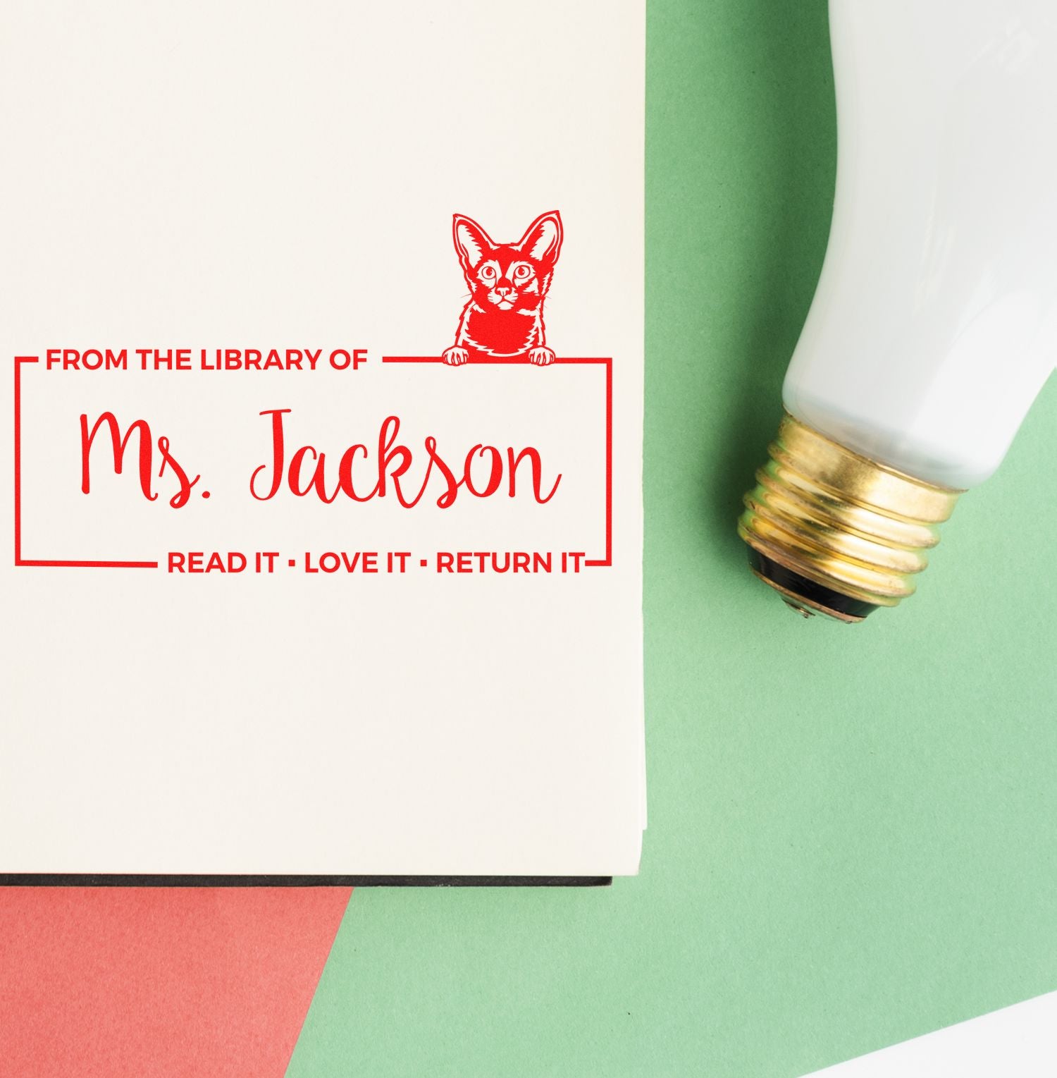 Custom rubber stamp for Ms. Jackson library books, with cat icon and Read it, Love it, Return it message.