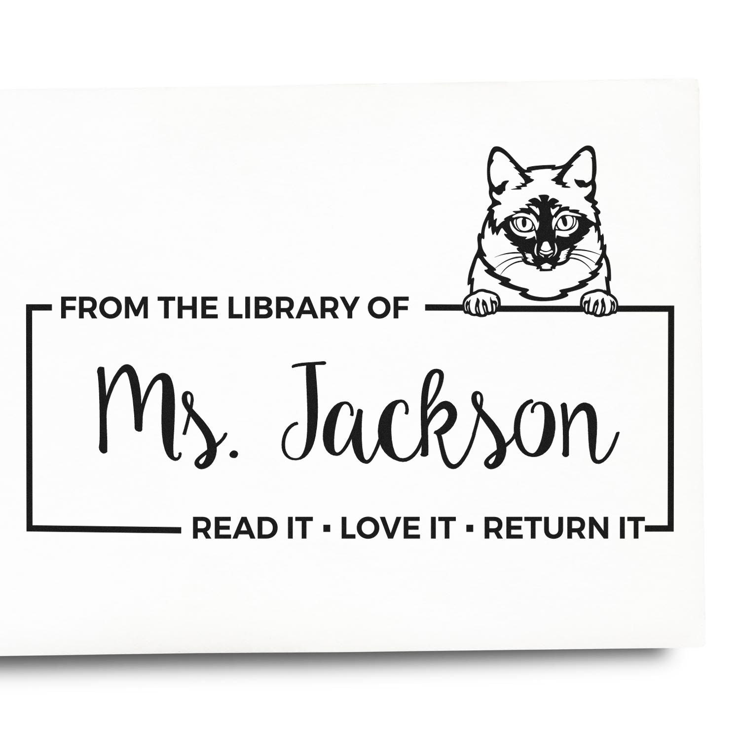 Personalized library rubber stamp for Ms. Jackson with cat art and Read It, Love It, Return It book label.