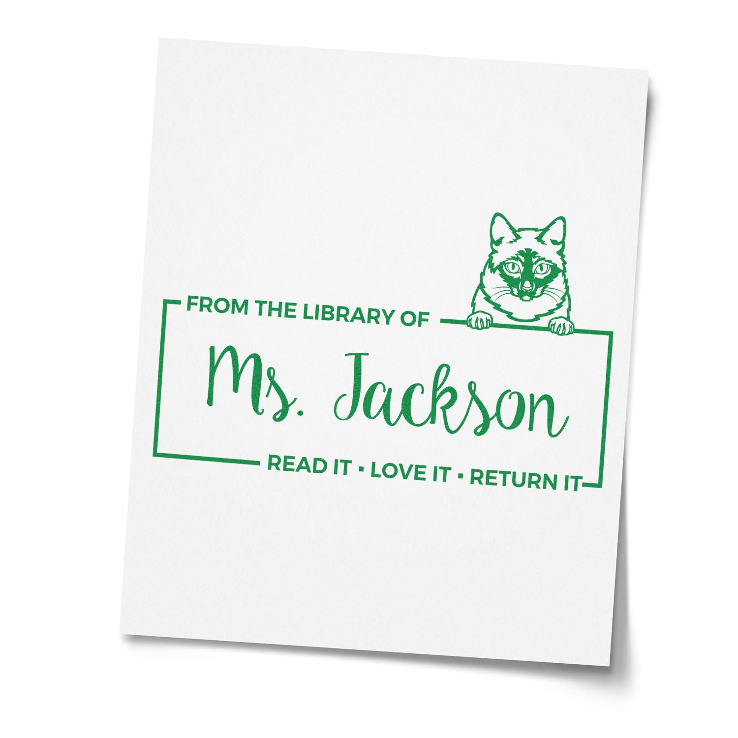 Custom cat library rubber stamp for Ms. Jackson, with Read it, love it, return it book owner label.