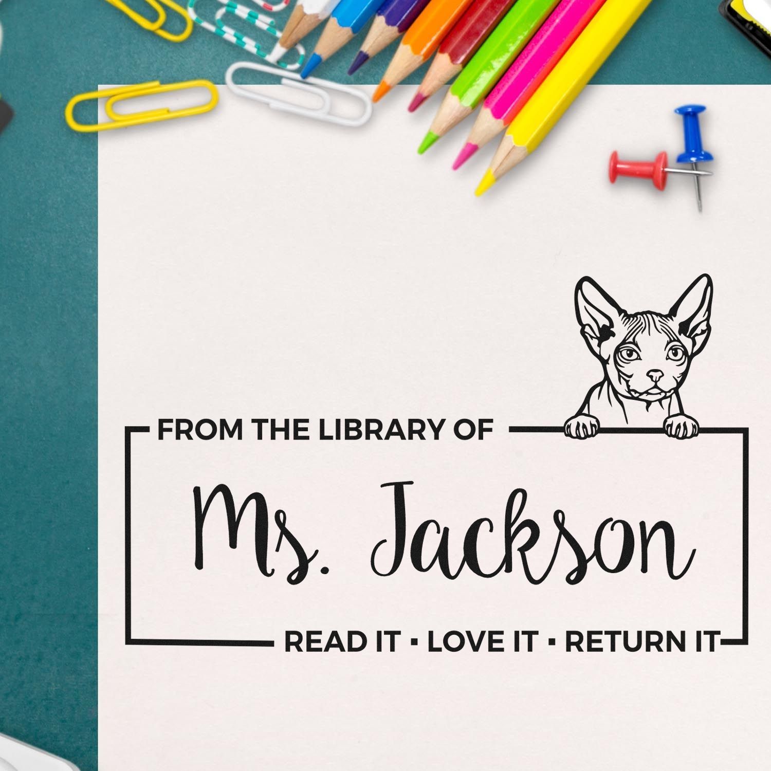 Personalized rubber library stamp for Ms. Jackson with cat design and Read It, Love It, Return It message.