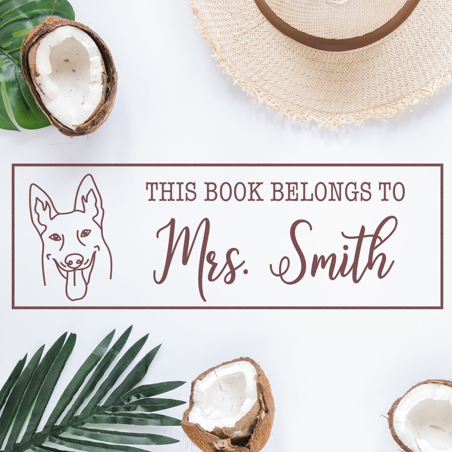 Custom rubber book stamp with dog illustration reading This book belongs to Mrs. Smith for personalized library books.