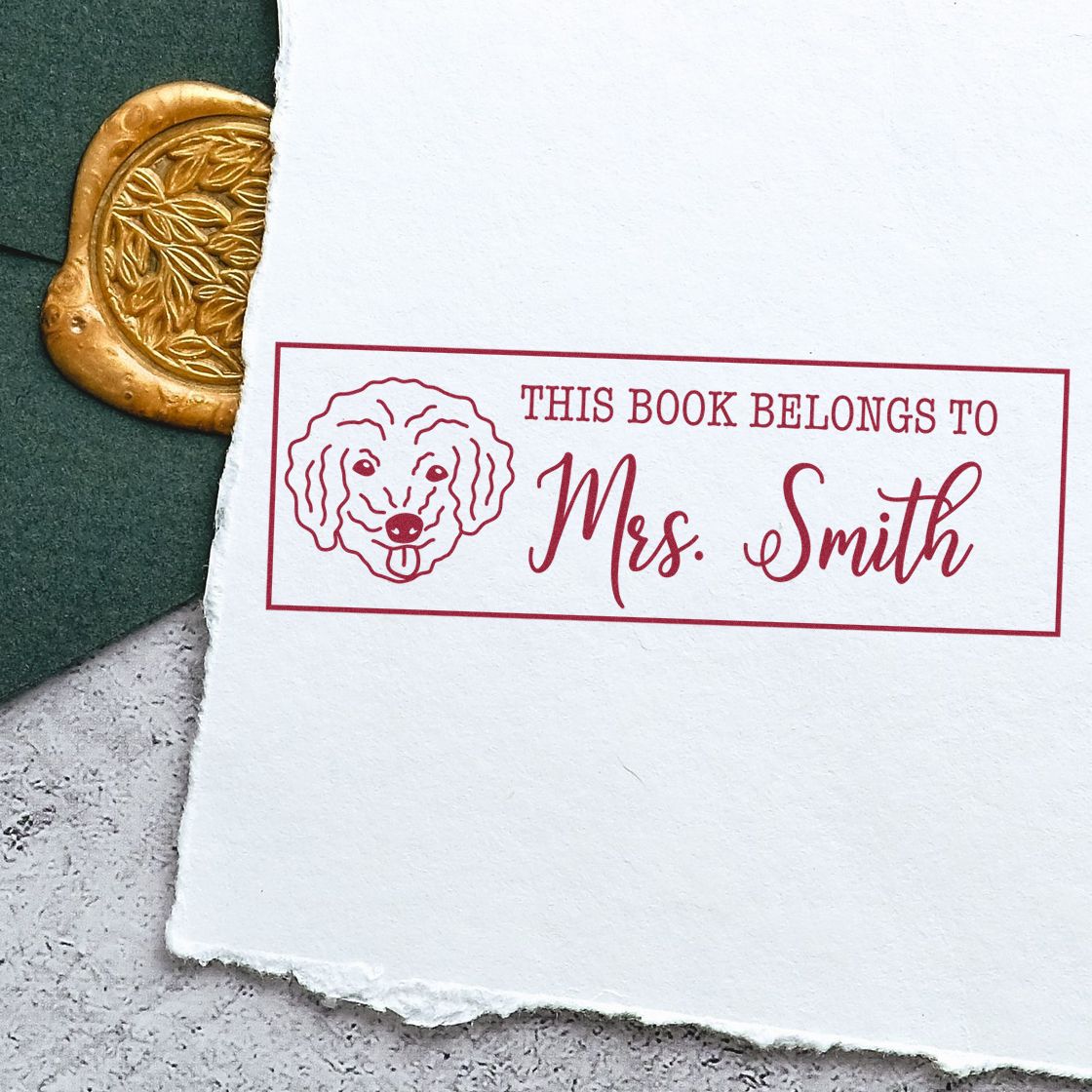Personalized rubber stamp bookplate for Mrs. Smith, reading This Book Belongs To, with dog illustration for custom library books.
