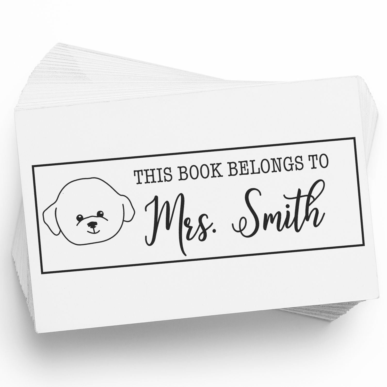 Personalized rubber book stamp with dog icon and This Book Belongs to Mrs. Smith for custom library labels.