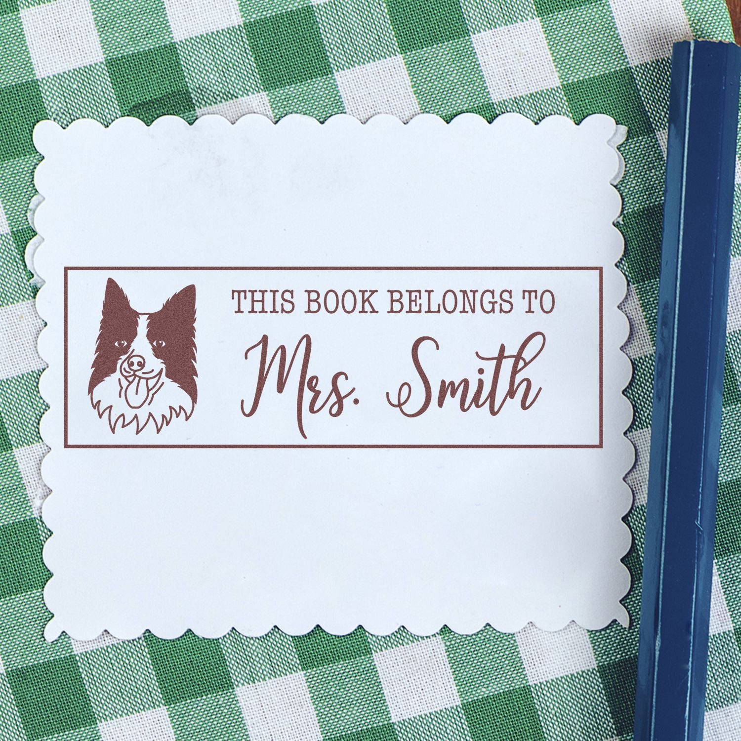 Custom rubber stamp for books reading This Book Belongs to Mrs. Smith with dog design, ideal for personalized library labeling.