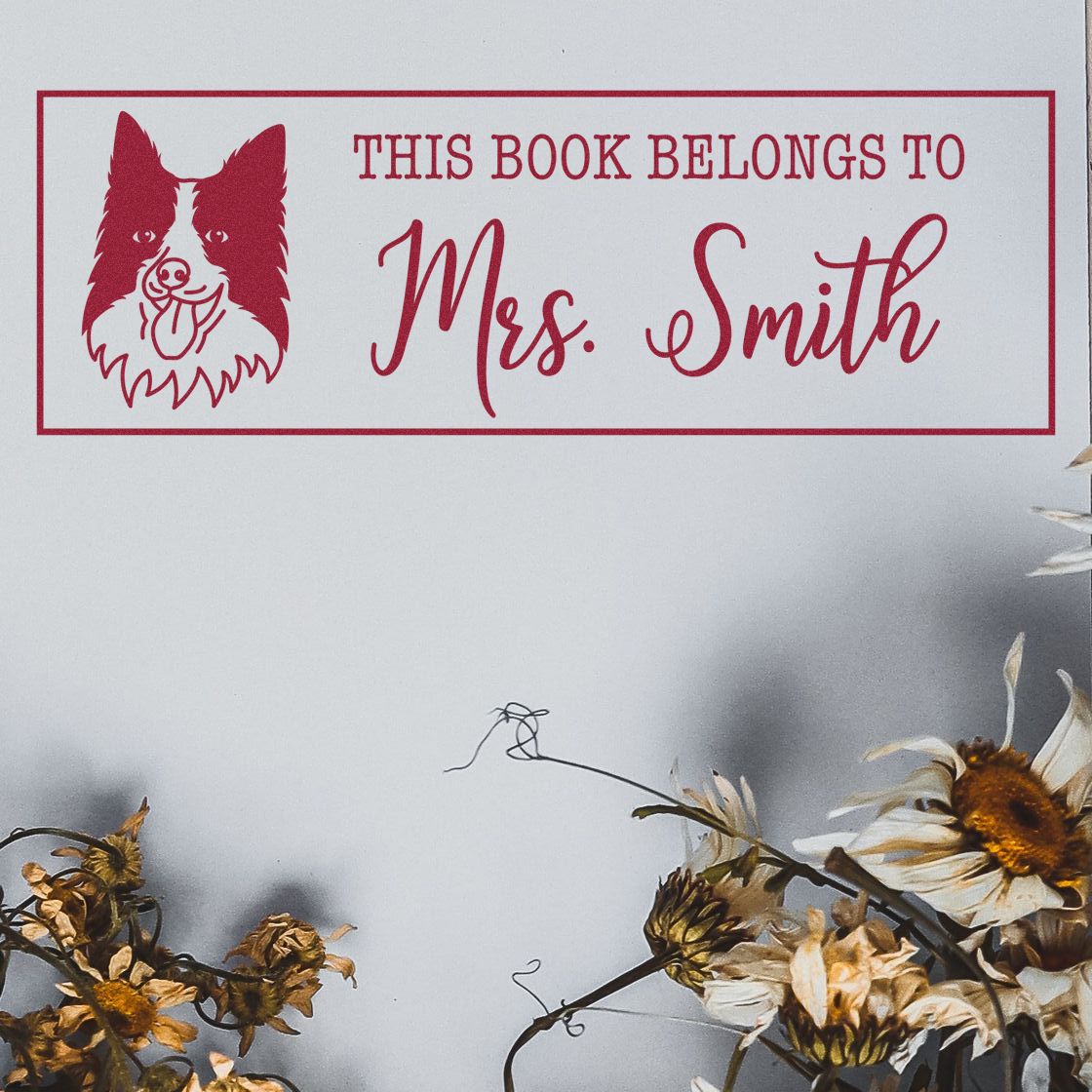 Custom rubber book stamp with dog design and This Book Belongs to Mrs. Smith for personal libraries.