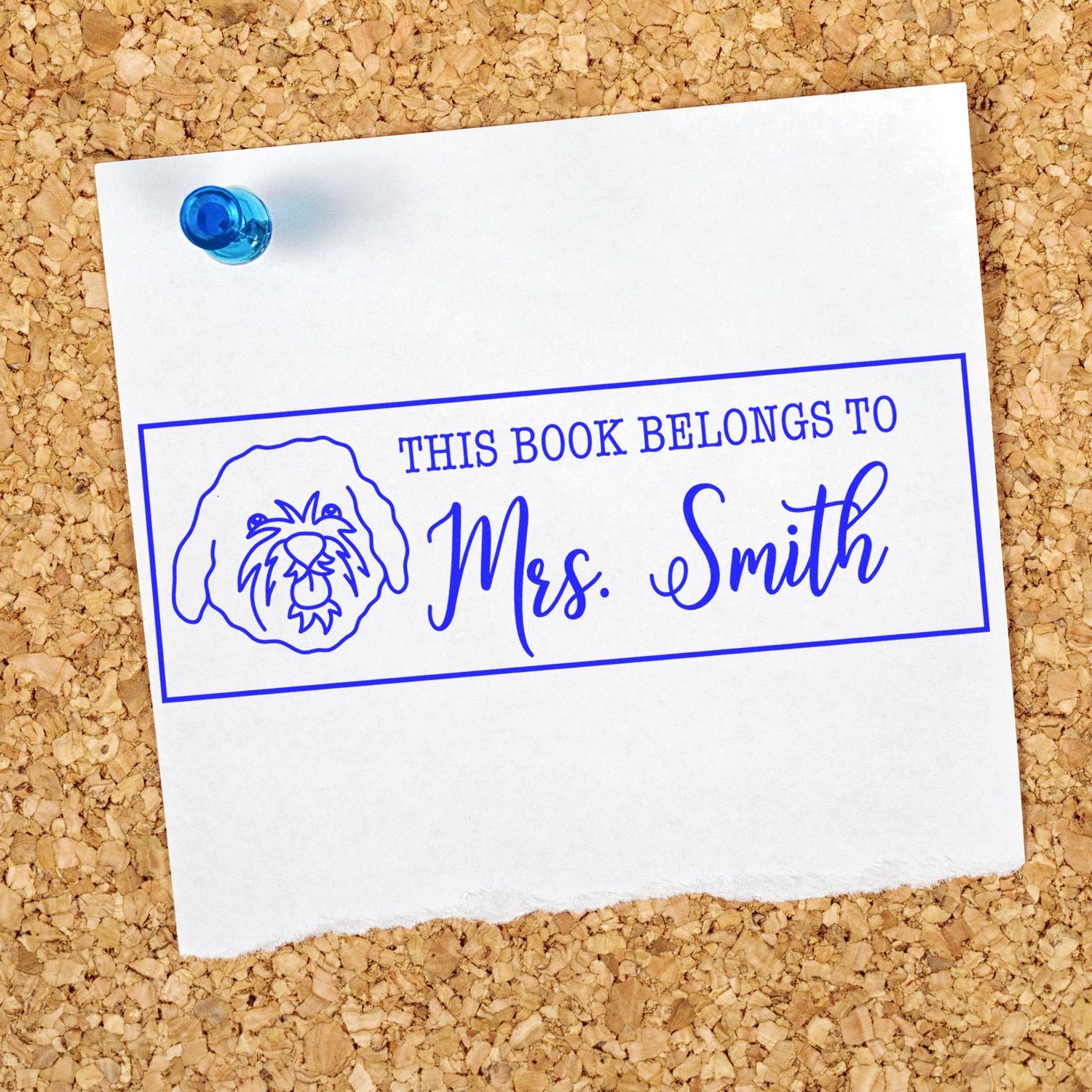 Personalized rubber stamp bookplate reading This Book Belongs to Mrs. Smith with dog illustration for custom library marking.