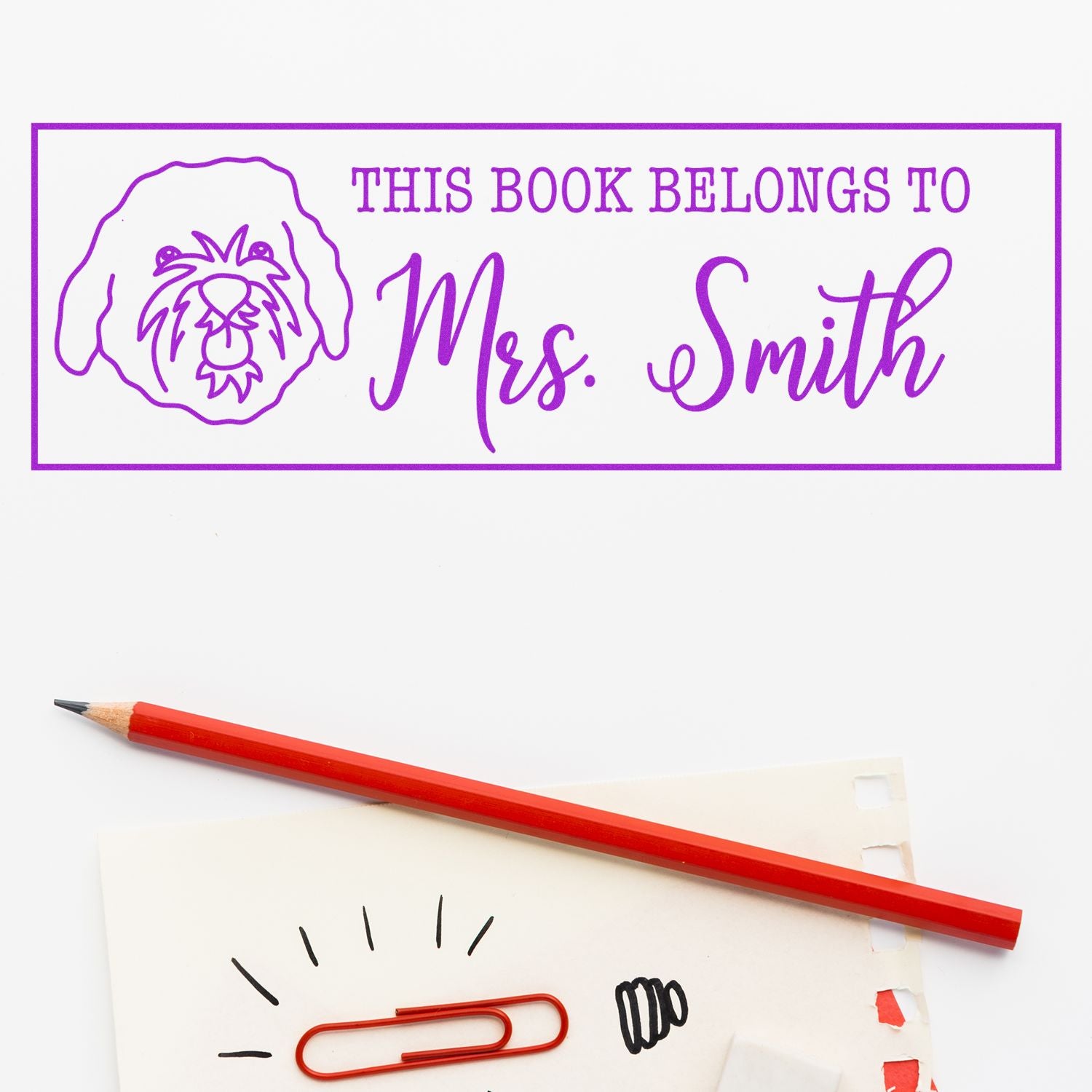 Custom rubber stamp bookplate reading This Book Belongs to Mrs. Smith with dog design for personalized library books.