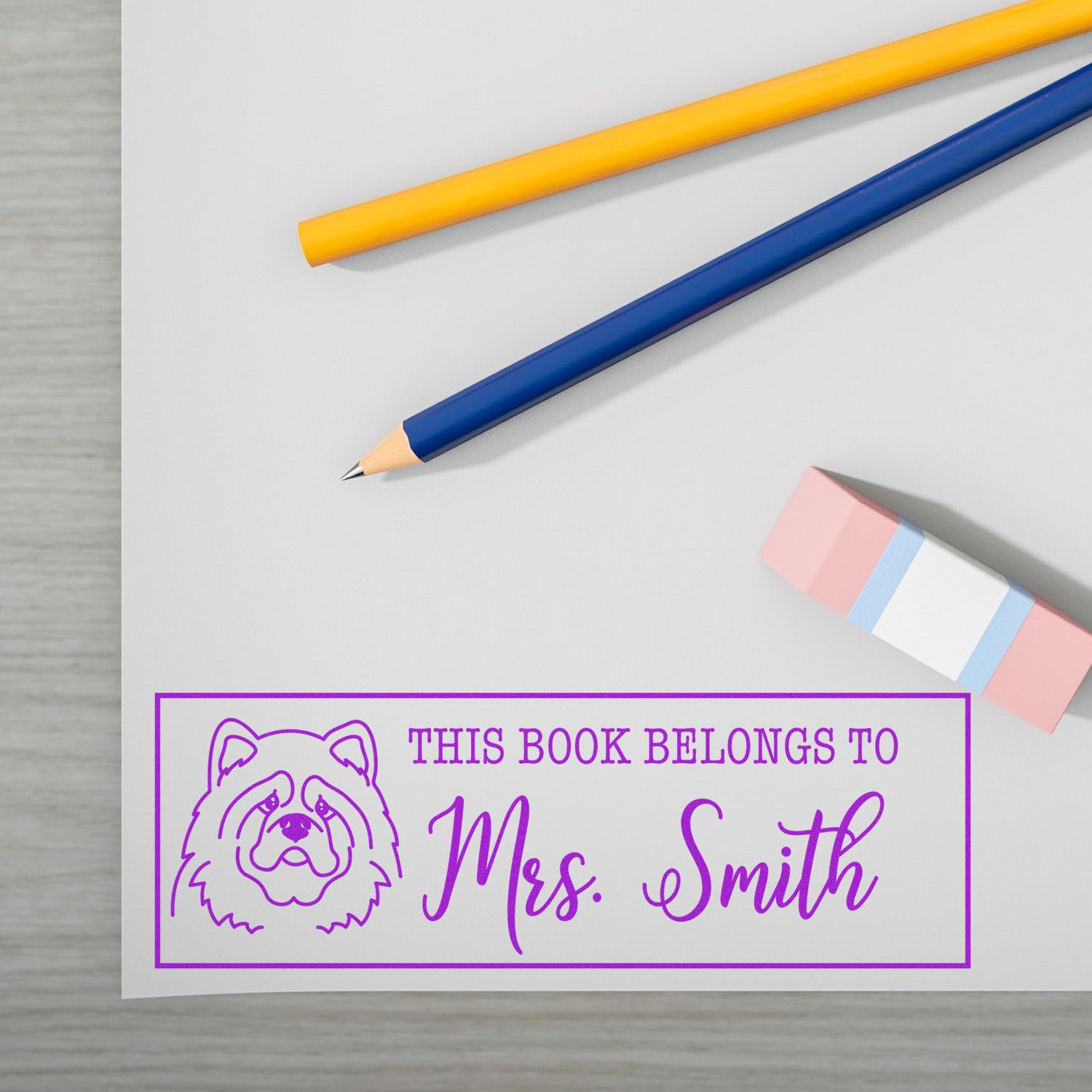 Custom rubber book stamp with dog design and Mrs. Smith name for personalized bookplate and library labeling.