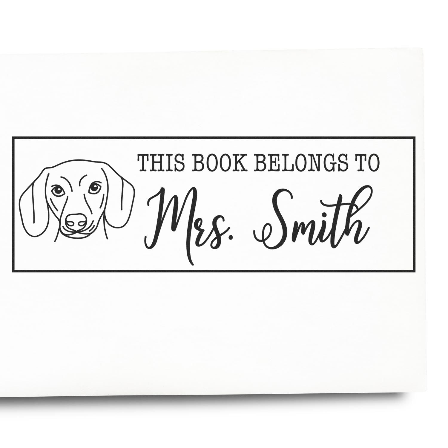 Custom dog book stamp reading This Book Belongs to Mrs. Smith for personal library labeling and book ownership.