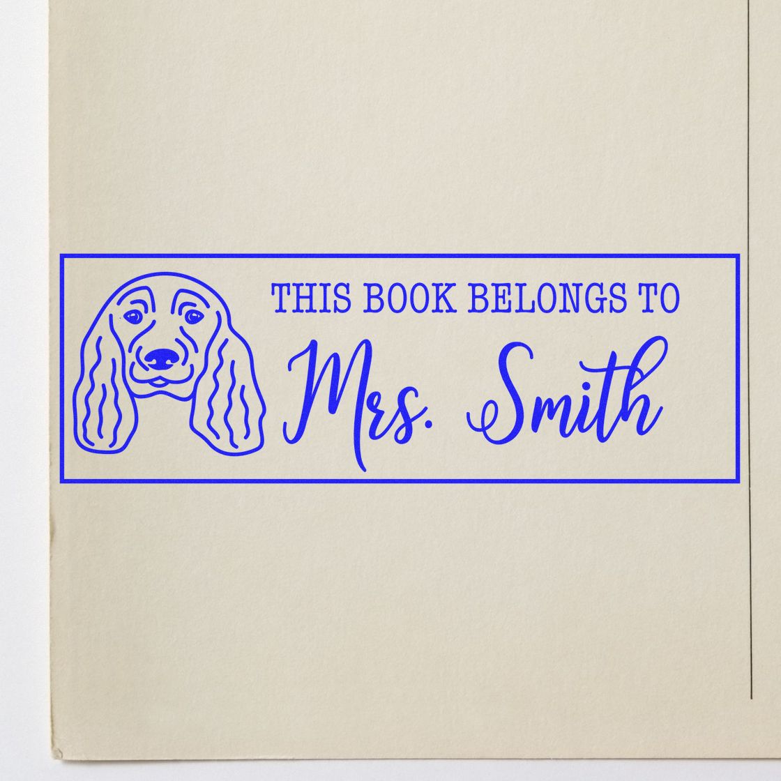 Personalized dog bookplate rubber stamp reading This Book Belongs to Mrs. Smith for custom library books.