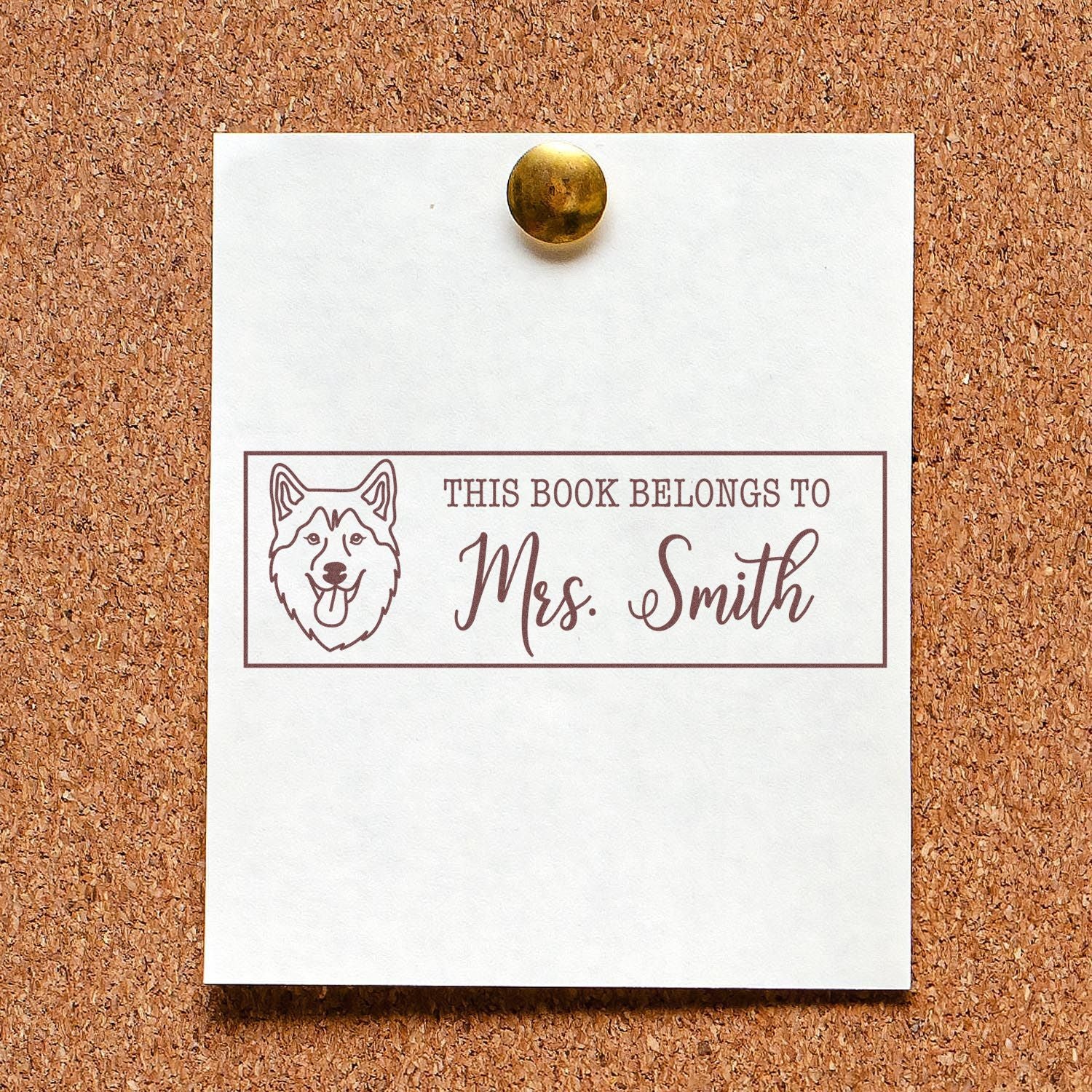 Custom book belongs to Mrs. Smith rubber stamp with dog illustration for personalized library labeling.