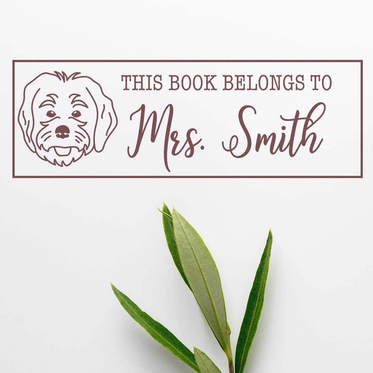Custom personalized This Book Belongs to Mrs. Smith rubber stamp with dog illustration for books and library use.
