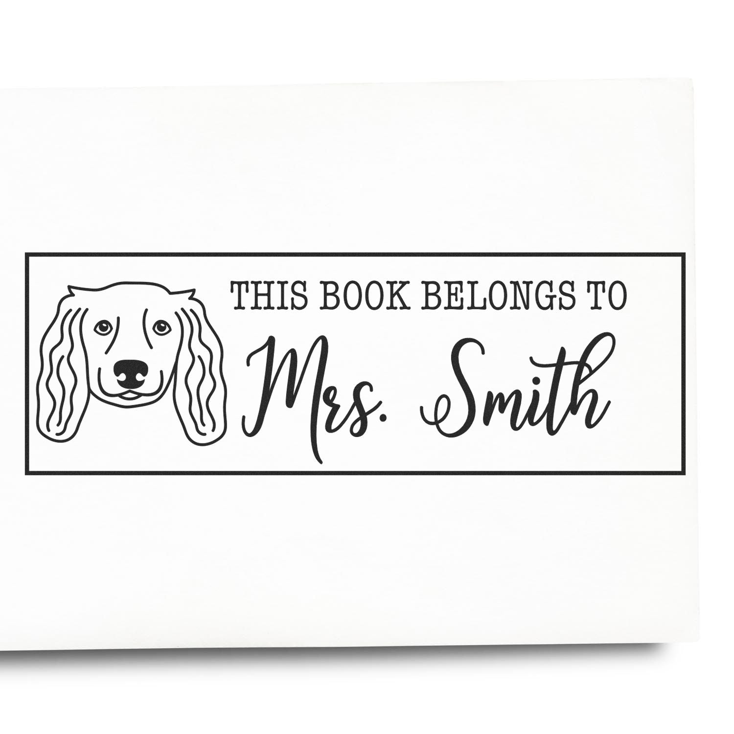 Personalized dog rubber stamp reading This Book Belongs to Mrs. Smith for custom book labels.