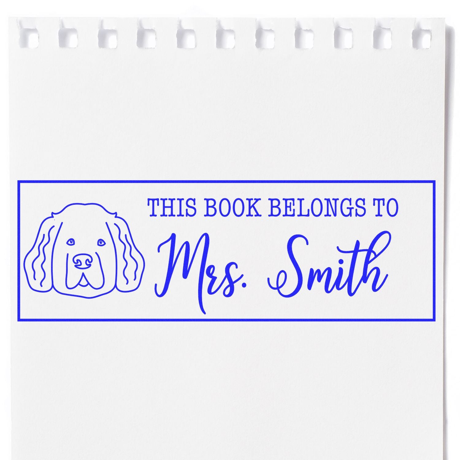 Custom dog book rubber stamp reading This Book Belongs to Mrs. Smith for personalized books.