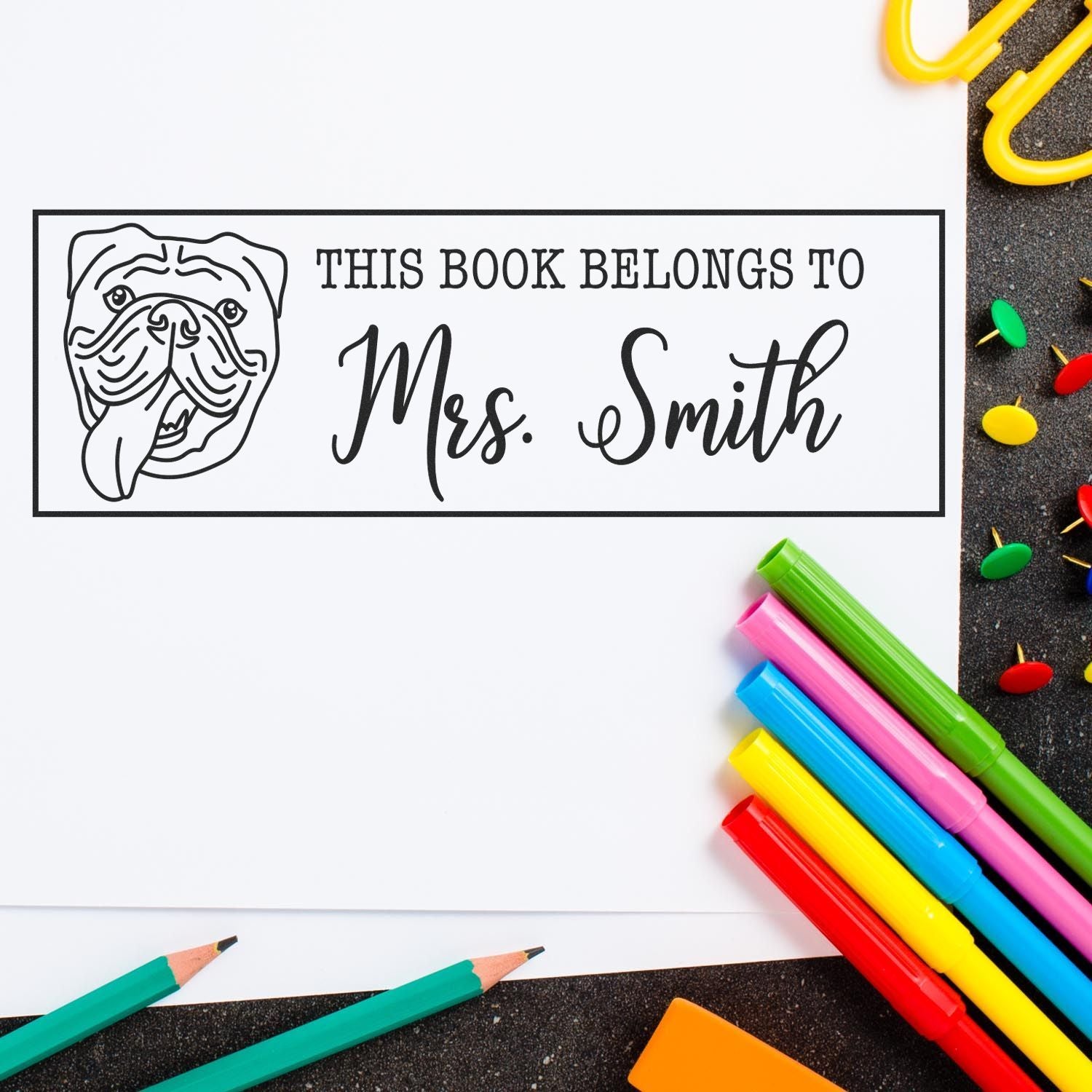 Custom bulldog rubber stamp for books, reading This Book Belongs to Mrs. Smith for personalized classroom book labeling.
