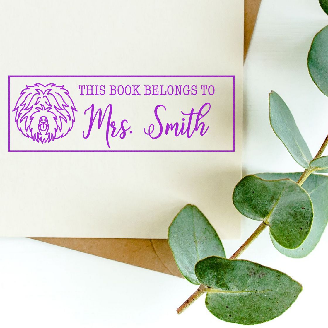 Custom ex libris rubber stamp with dog design reading This book belongs to Mrs. Smith for personalized books.