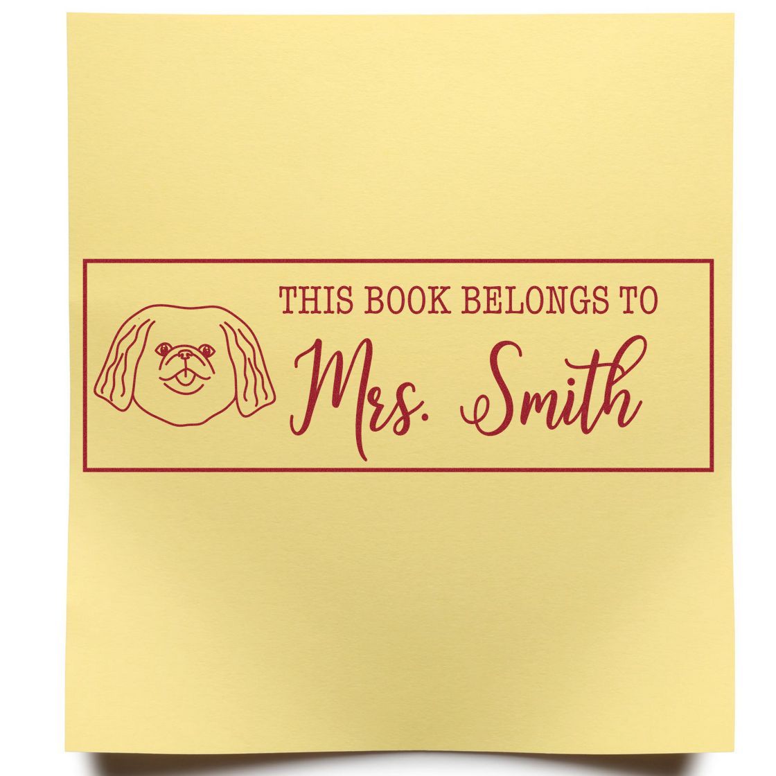 Custom rubber stamp for books reading This Book Belongs to Mrs. Smith with dog icon, ideal for personalizing library books.