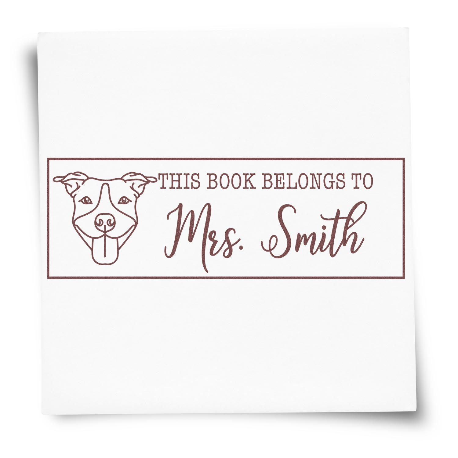 Personalized dog book stamp reading This Book Belongs to Mrs. Smith for labeling library books and classroom materials.