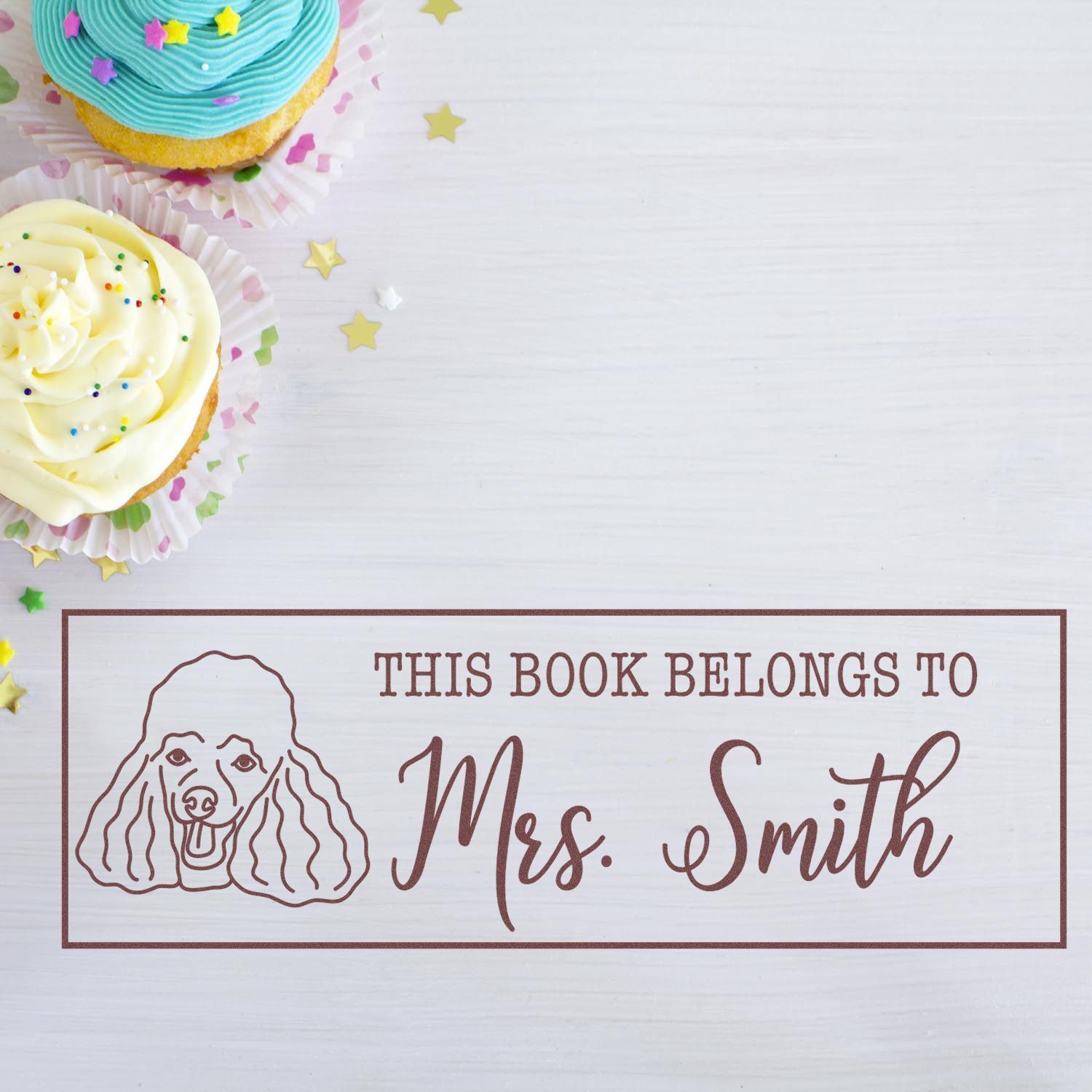 Custom rubber stamp with dog illustration and This Book Belongs to Mrs. Smith text for personal book labeling.