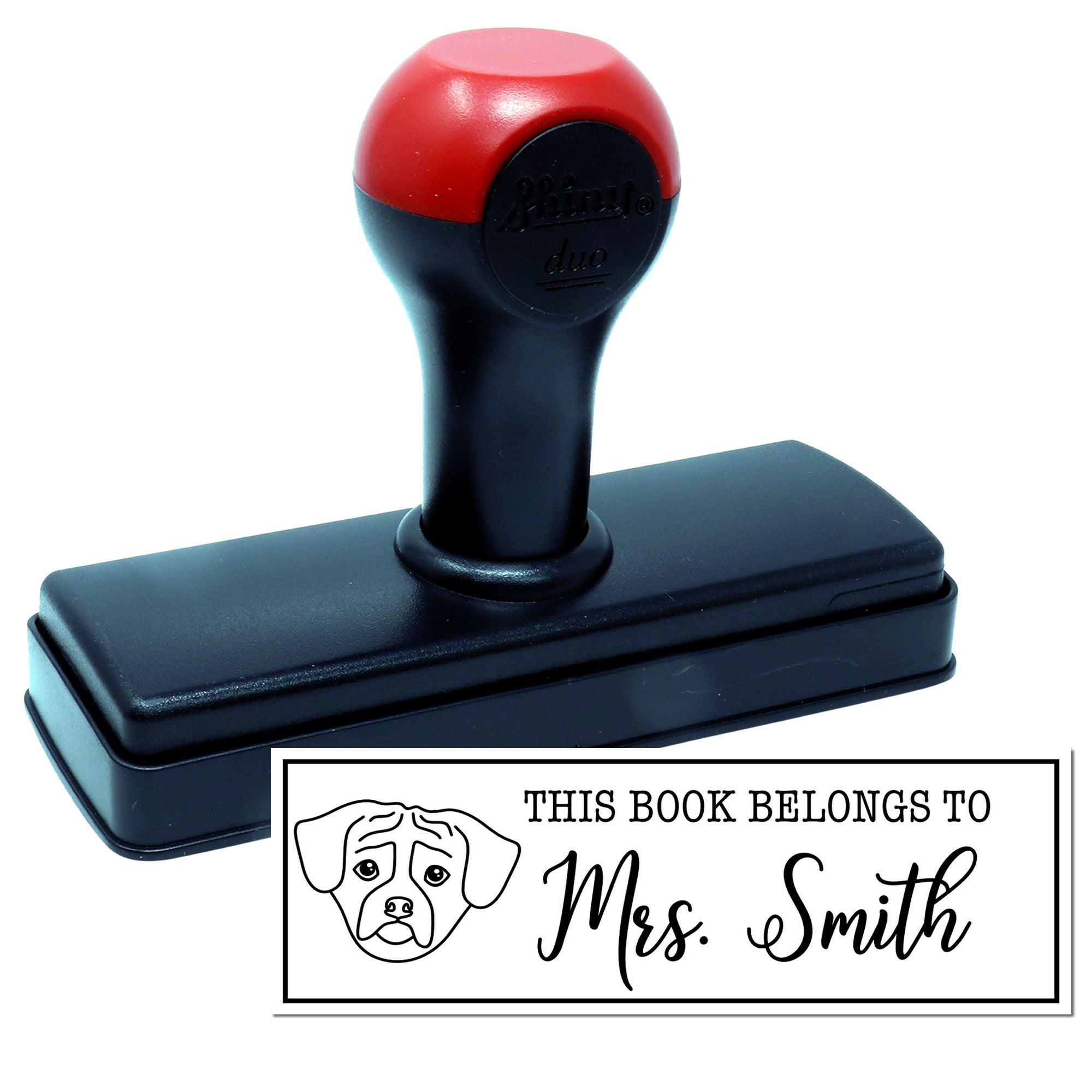 Personalized self-inking rubber book stamp with dog design and custom This Book Belongs To name imprint.