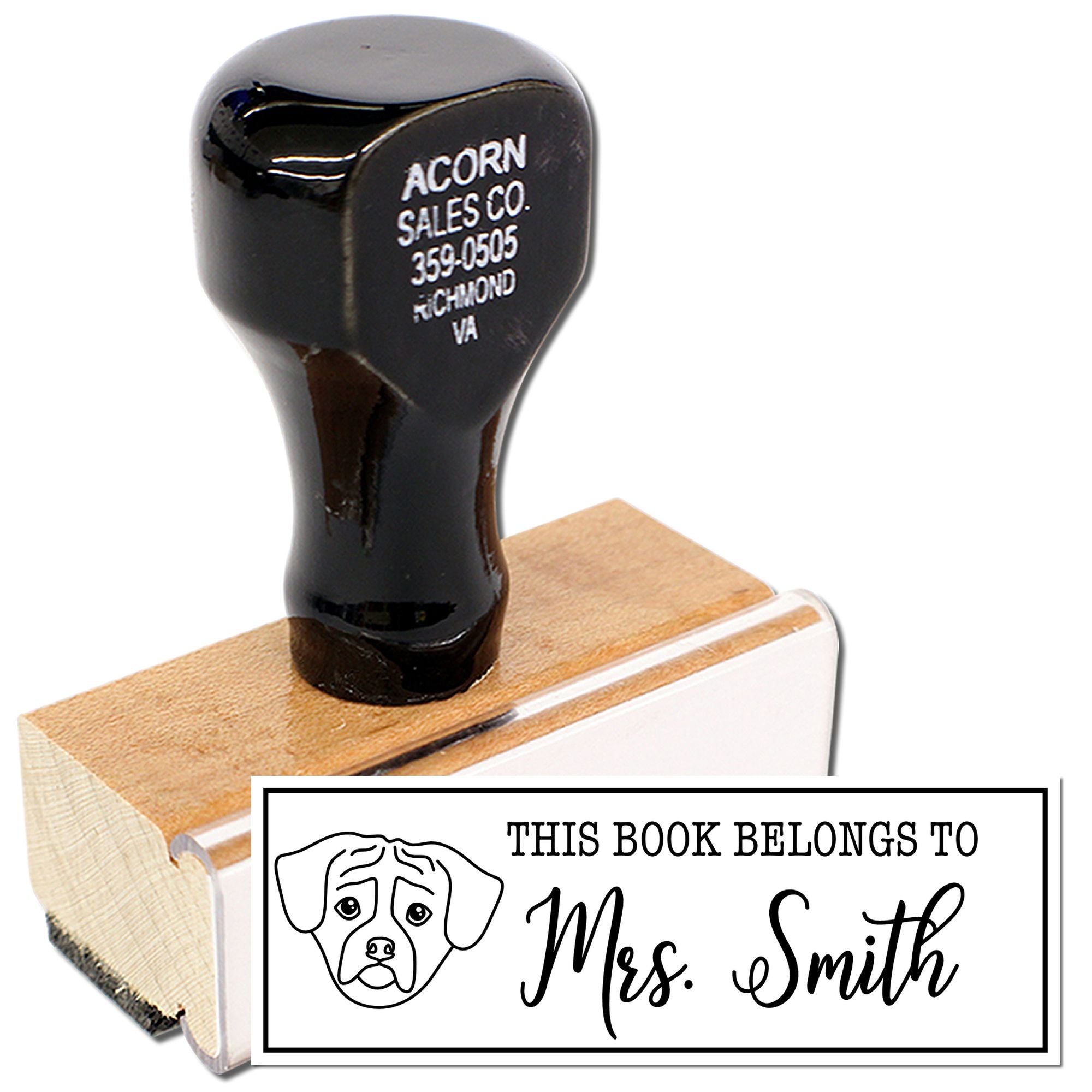 Custom rubber book stamp with dog design and personalized This Book Belongs to Mrs. Smith imprint for library books.