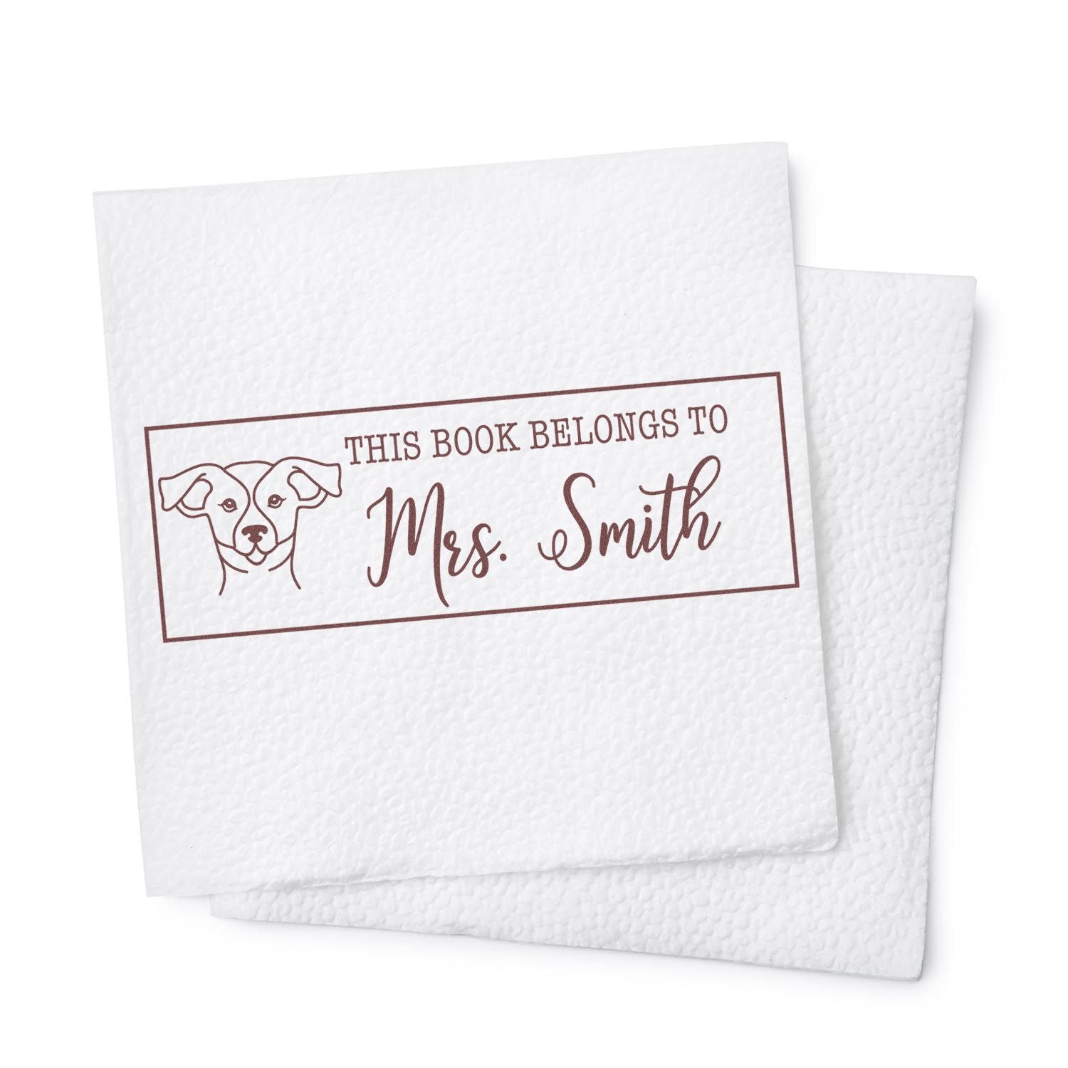 Custom dog book rubber stamp with This Book Belongs to Mrs. Smith for personalized library books and teacher gifts.