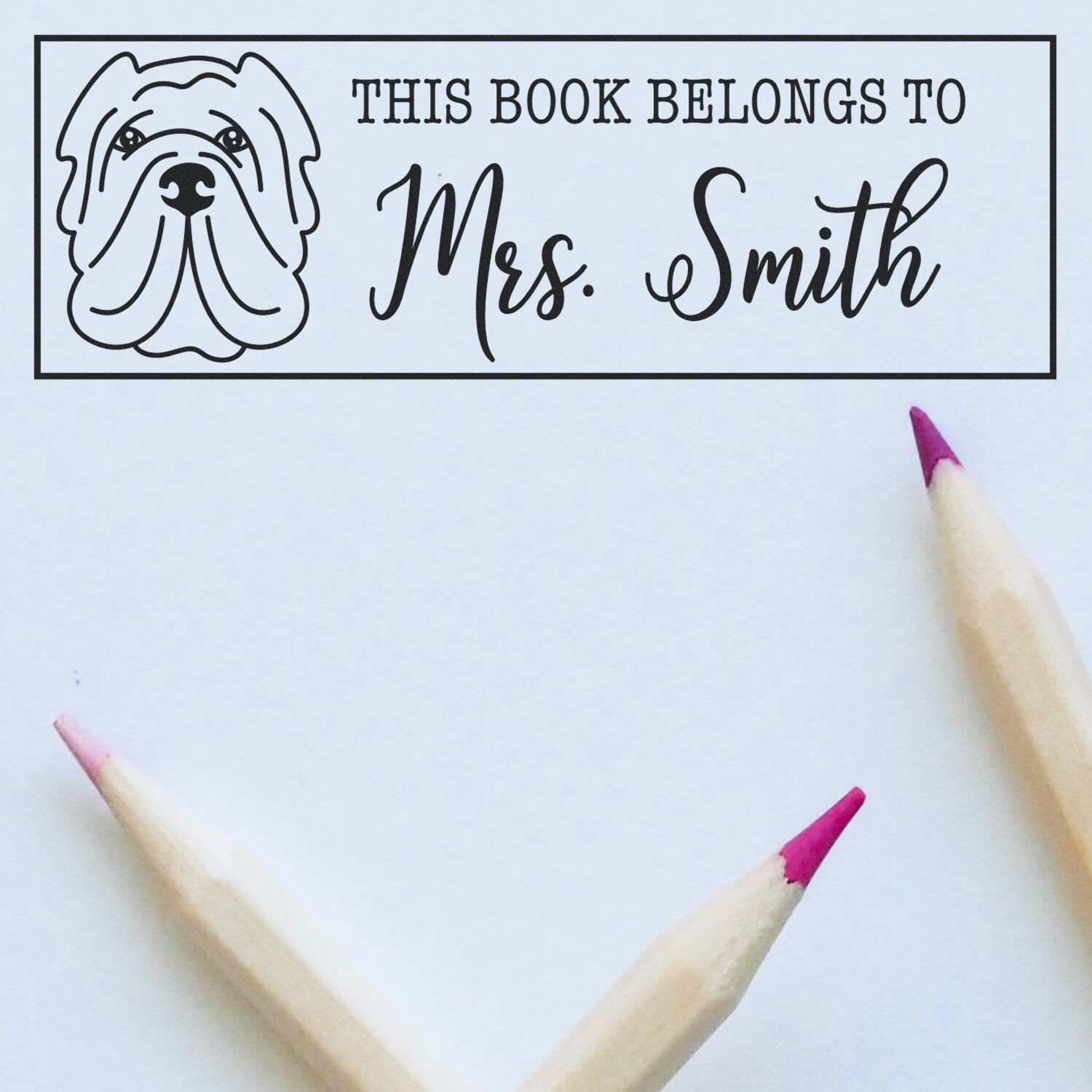 Personalized dog book stamp reading This Book Belongs to Mrs. Smith for custom library marking and classroom book organization.