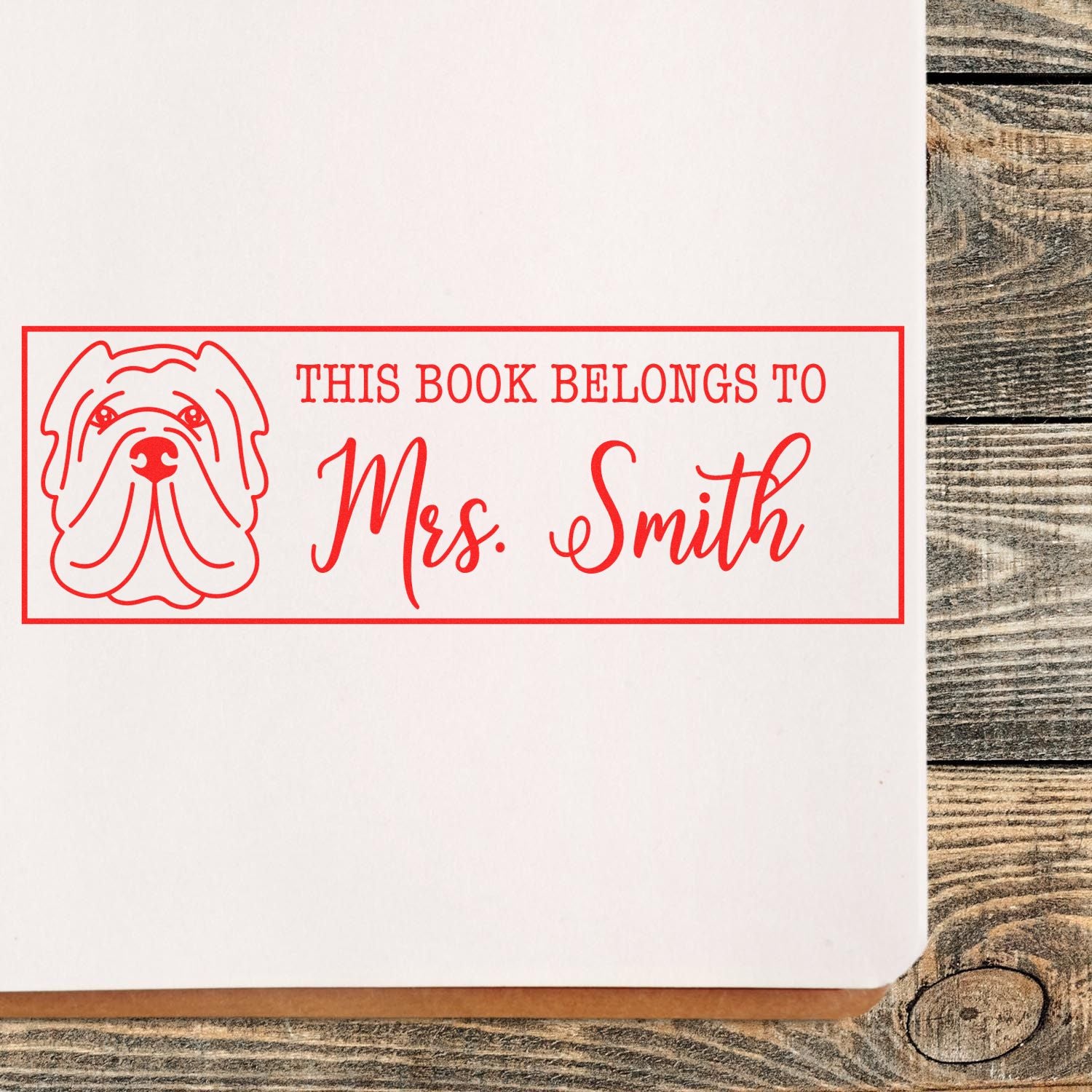Personalized dog rubber stamp with This Book Belongs To Mrs. Smith for custom book labeling and library use.