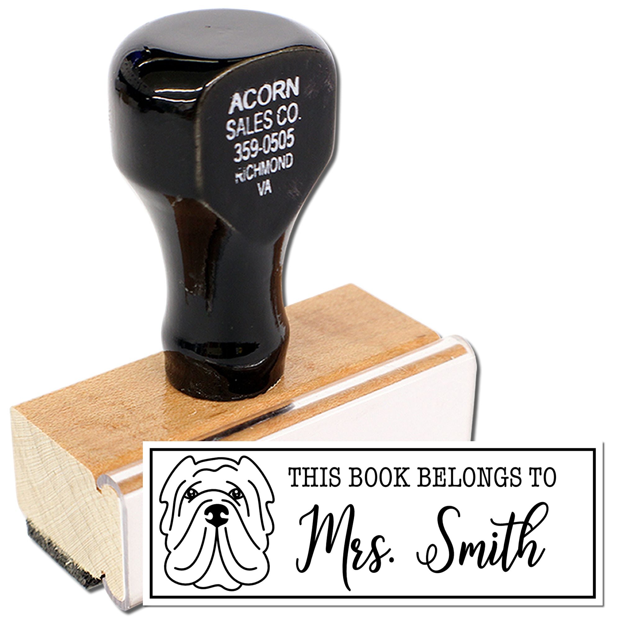 Personalized rubber book stamp with dog design, reading This Book Belongs to Mrs. Smith for library books.