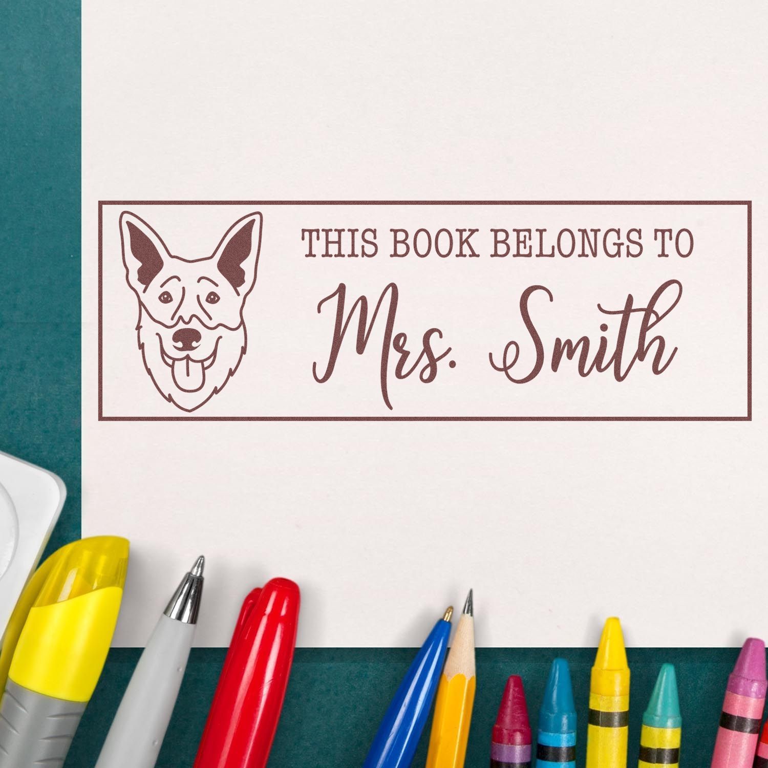 Personalized bookplate rubber stamp with dog portrait and This Book Belongs to Mrs. Smith for library books.