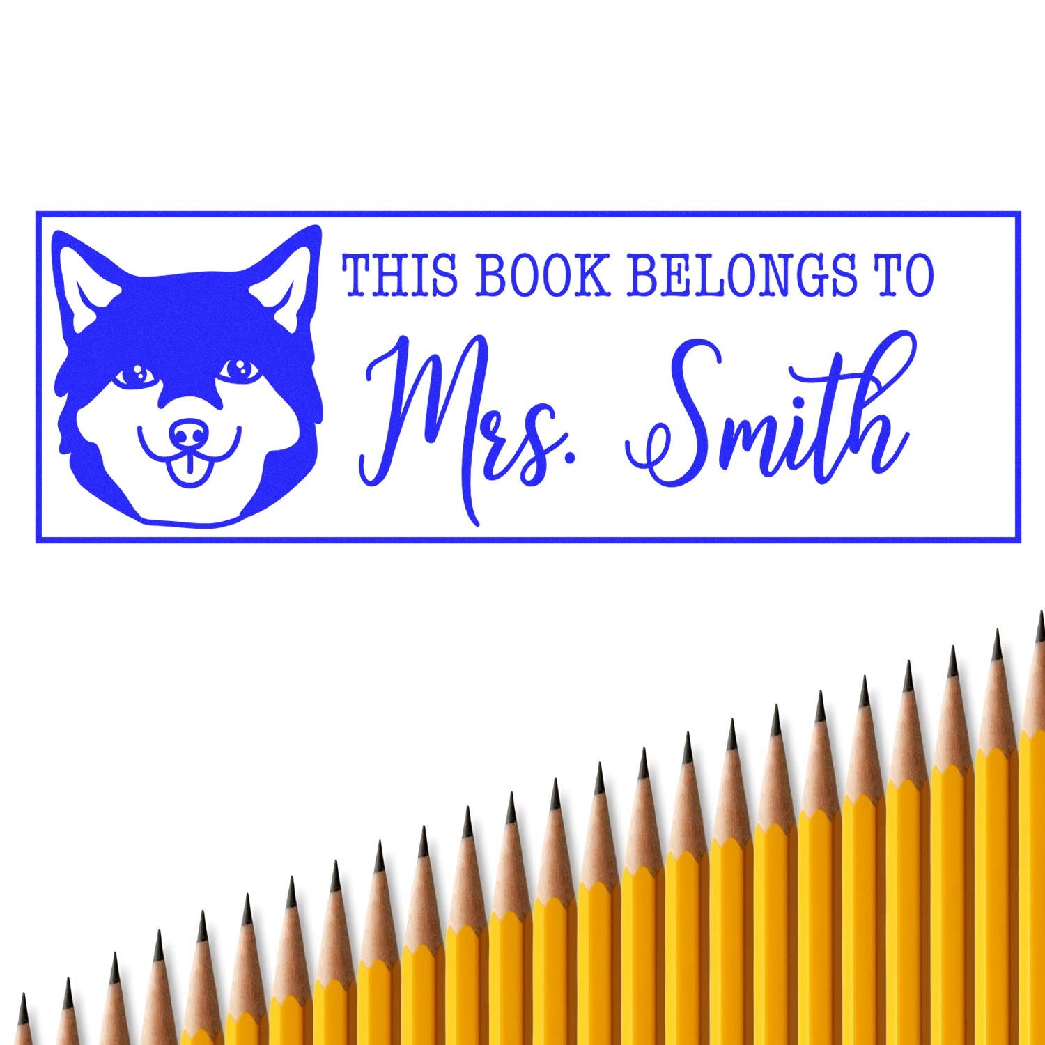 Custom rubber stamp with wolf icon and This Book Belongs to Mrs. Smith for personalized teacher or school library books.
