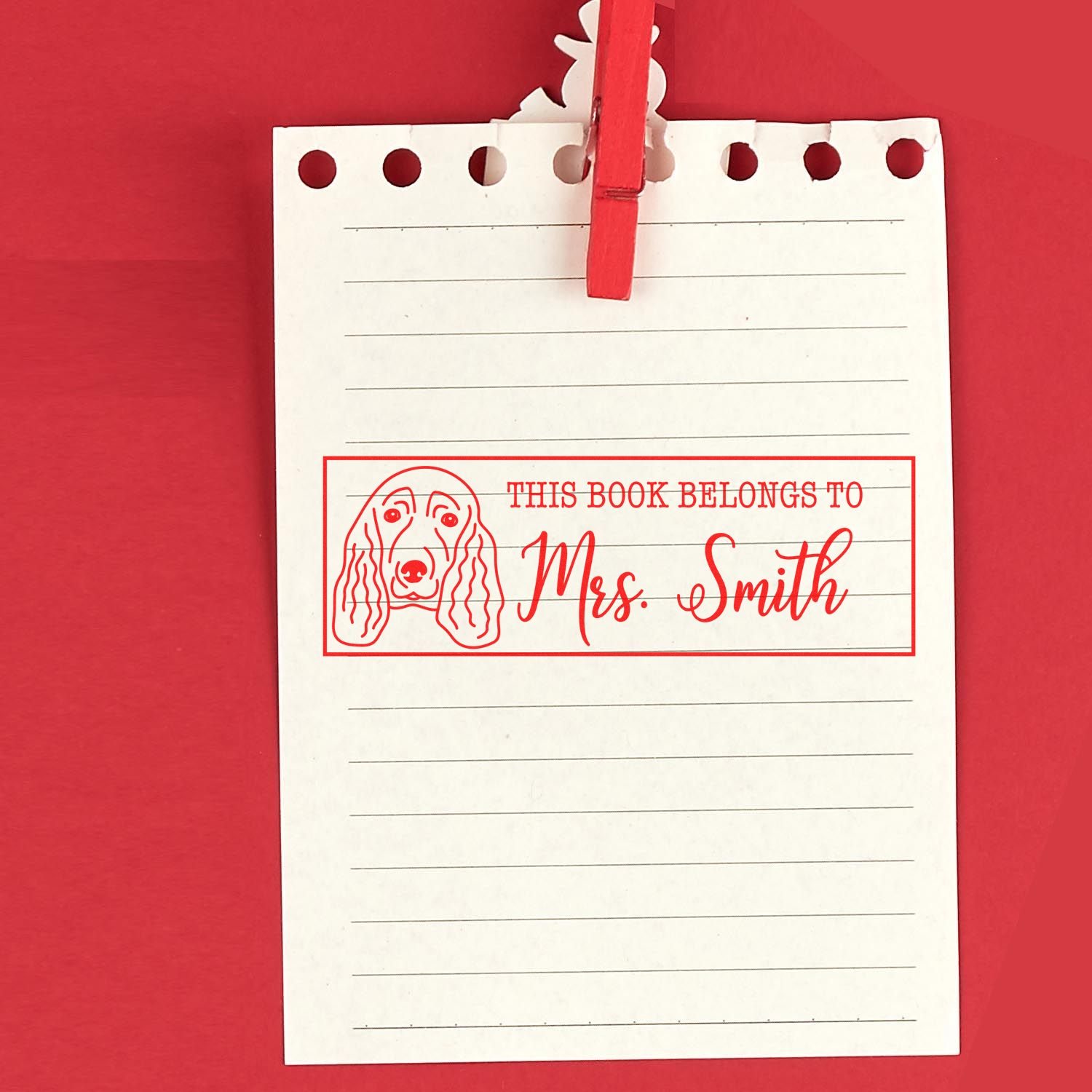Custom bookplate rubber stamp with dog illustration and This Book Belongs to Mrs. Smith text for personal library marking.
