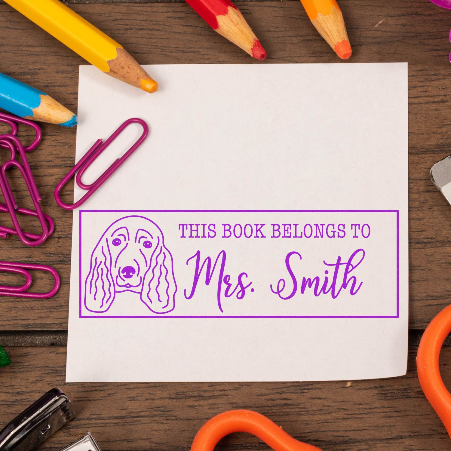 Custom rubber stamp bookplate with dog illustration and This Book Belongs to Mrs. Smith for personalized books