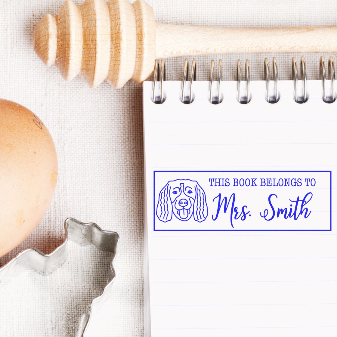 Personalized rubber stamp for books reading This book belongs to Mrs. Smith with dog illustration for custom bookplates.