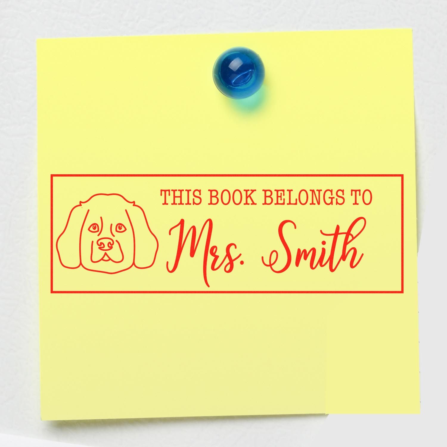 Custom rubber book stamp with dog design reading This Book Belongs to Mrs. Smith for teacher library books.