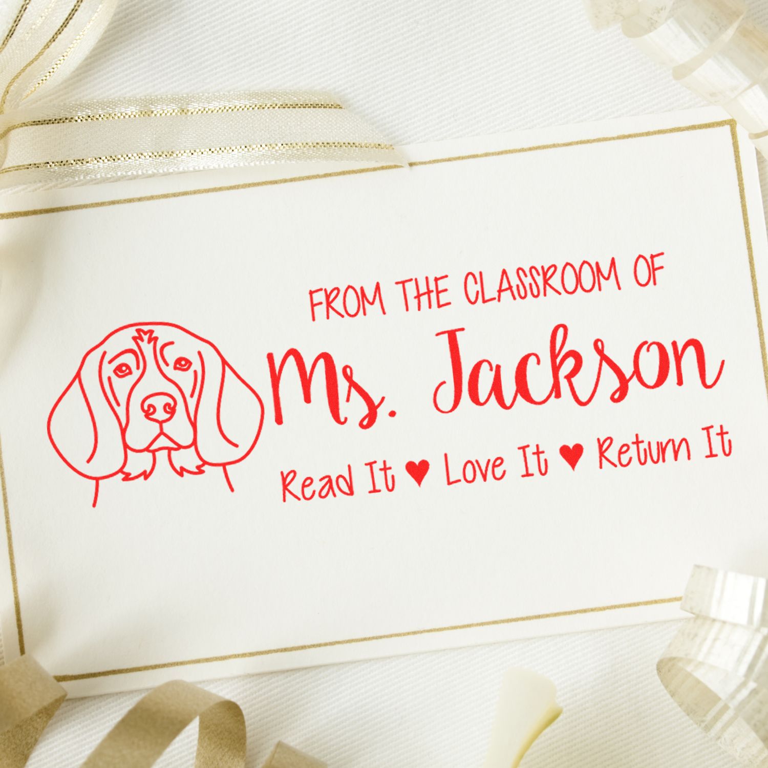 Personalized teacher rubber stamp for Ms. Jackson with dog icon and Read It, Love It, Return It classroom message.