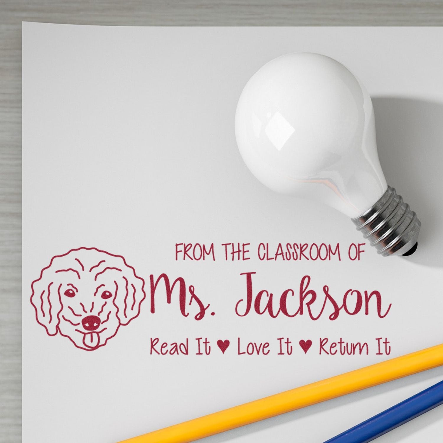 Teacher rubber stamp reading From the Classroom of Ms. Jackson, Read It Love It Return It with dog logo for books and classroom use